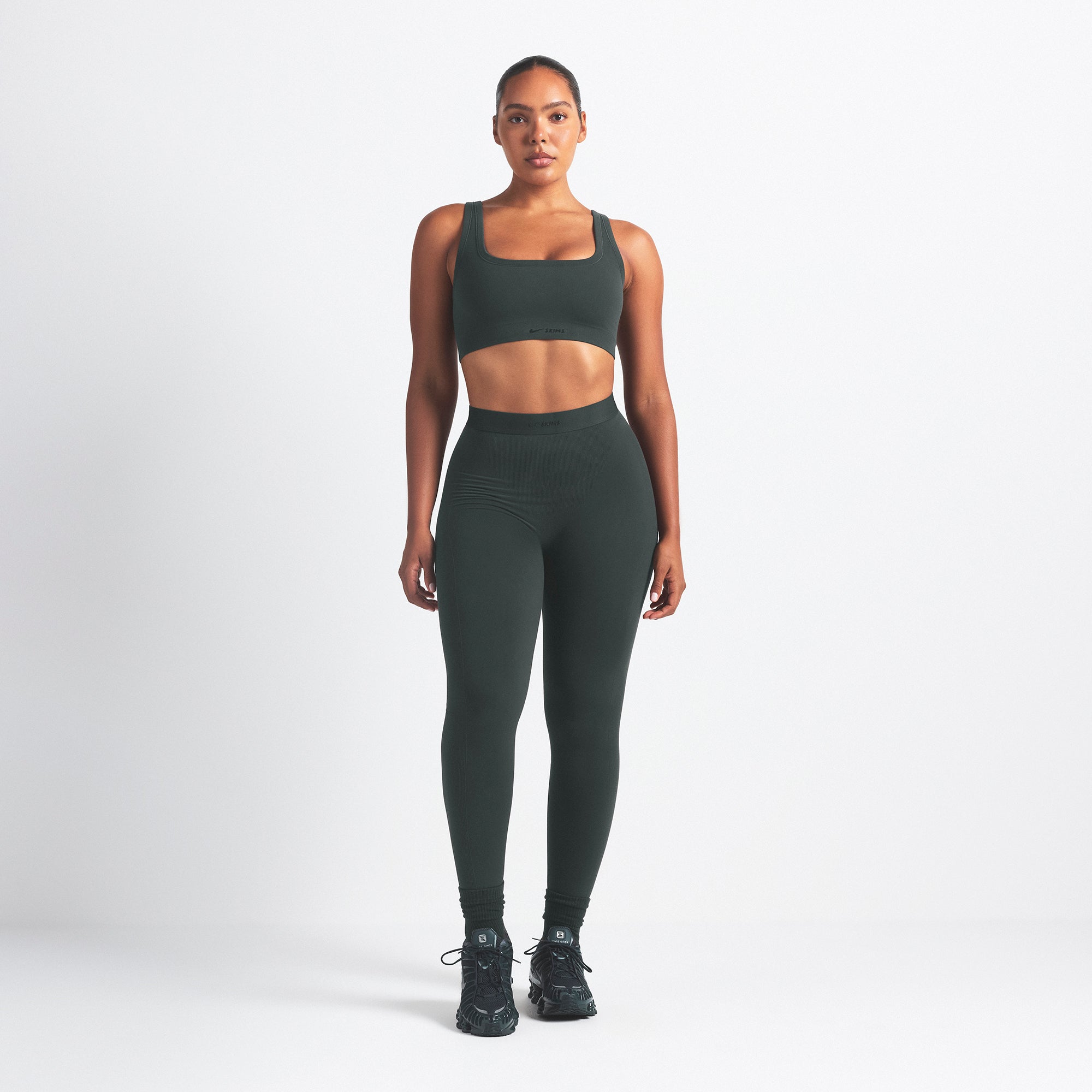 NikeSKIMS VINTAGE SEAMLESS SCOOP NECK BRA | DARK TEAL ON A MODEL FRONT VIEW @ | FOCUS: 0.0, 1.0, 0.9