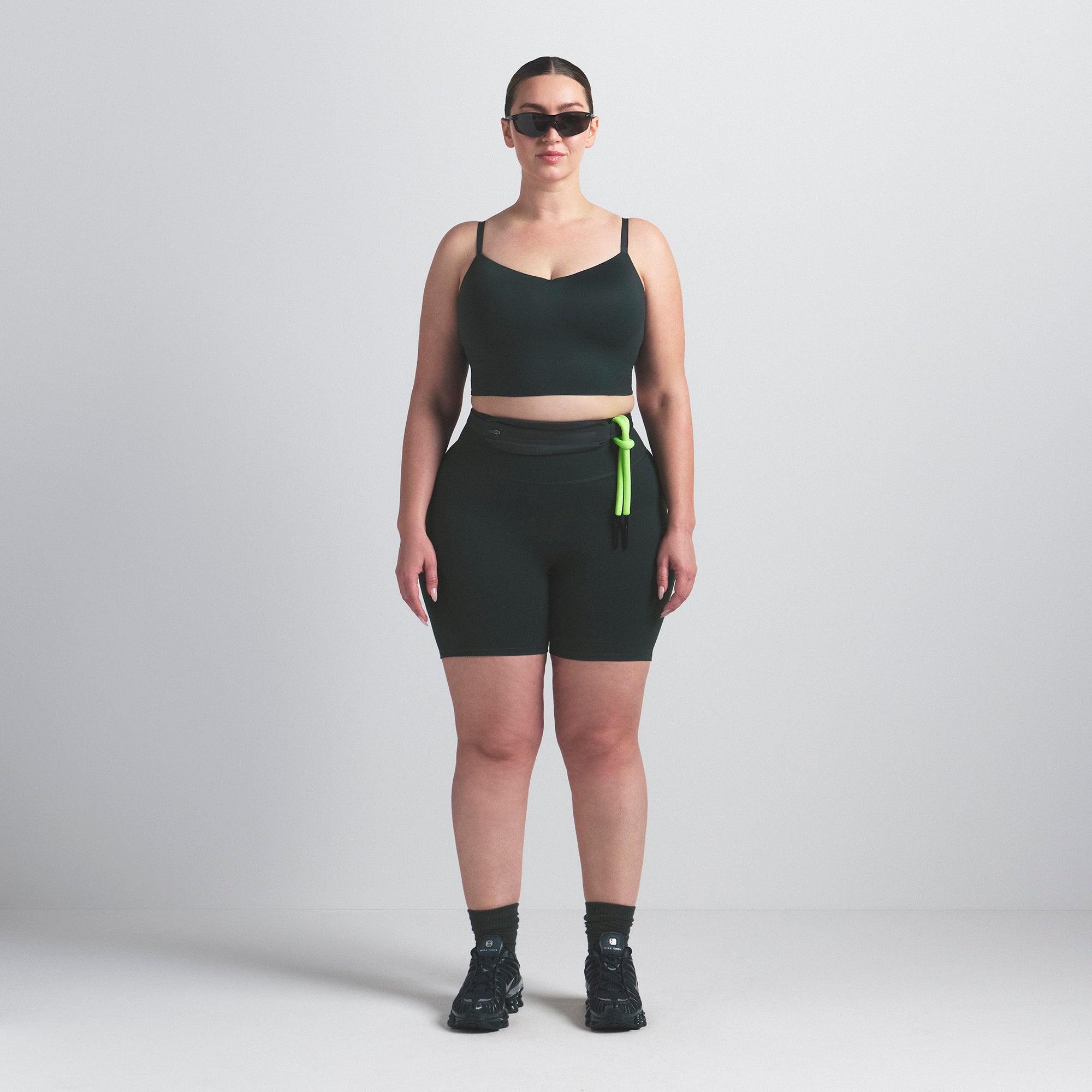 NikeSKIMS MATTE CAMI BRA TOP | DARK TEAL ON A MODEL FRONT VIEW @ | FOCUS: 0.0, 1.0, 0.9