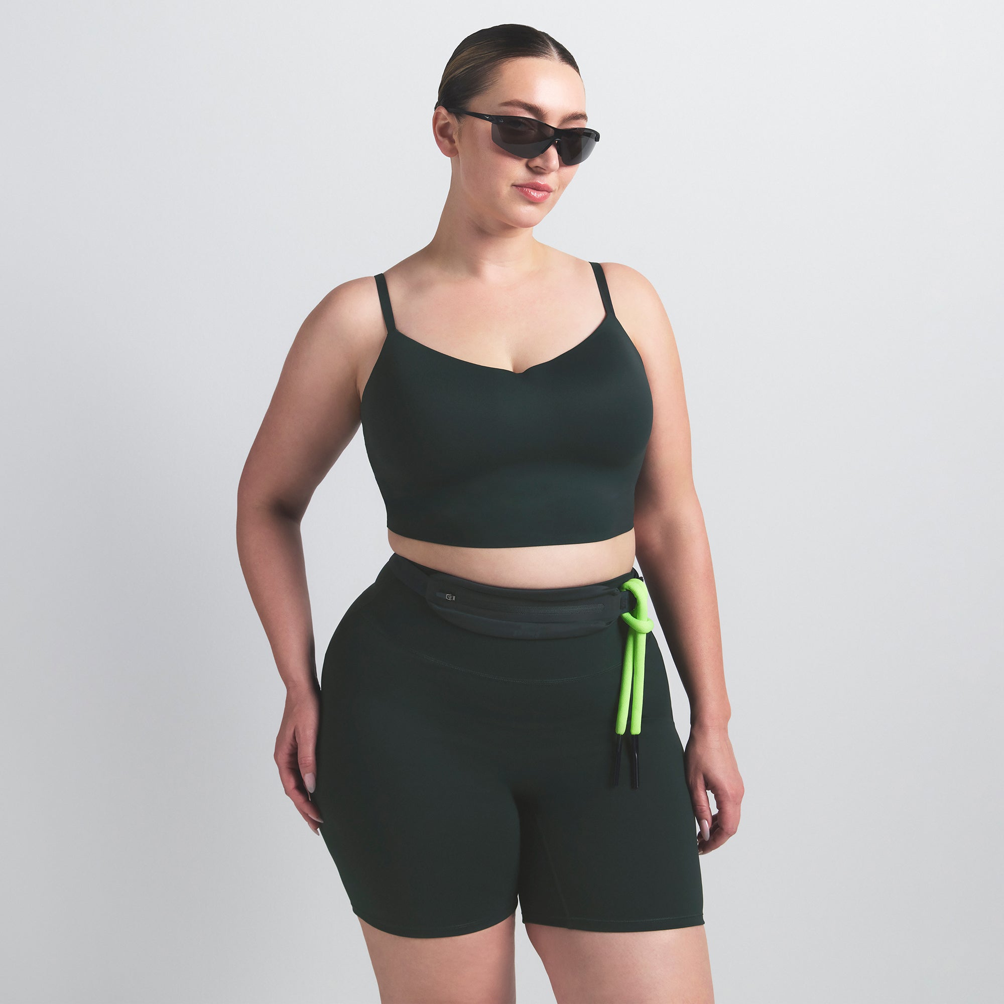 NikeSKIMS MATTE CAMI BRA TOP | DARK TEAL ON A MODEL SIDE VIEW @ | FOCUS: 0.0, 1.0, 0.9