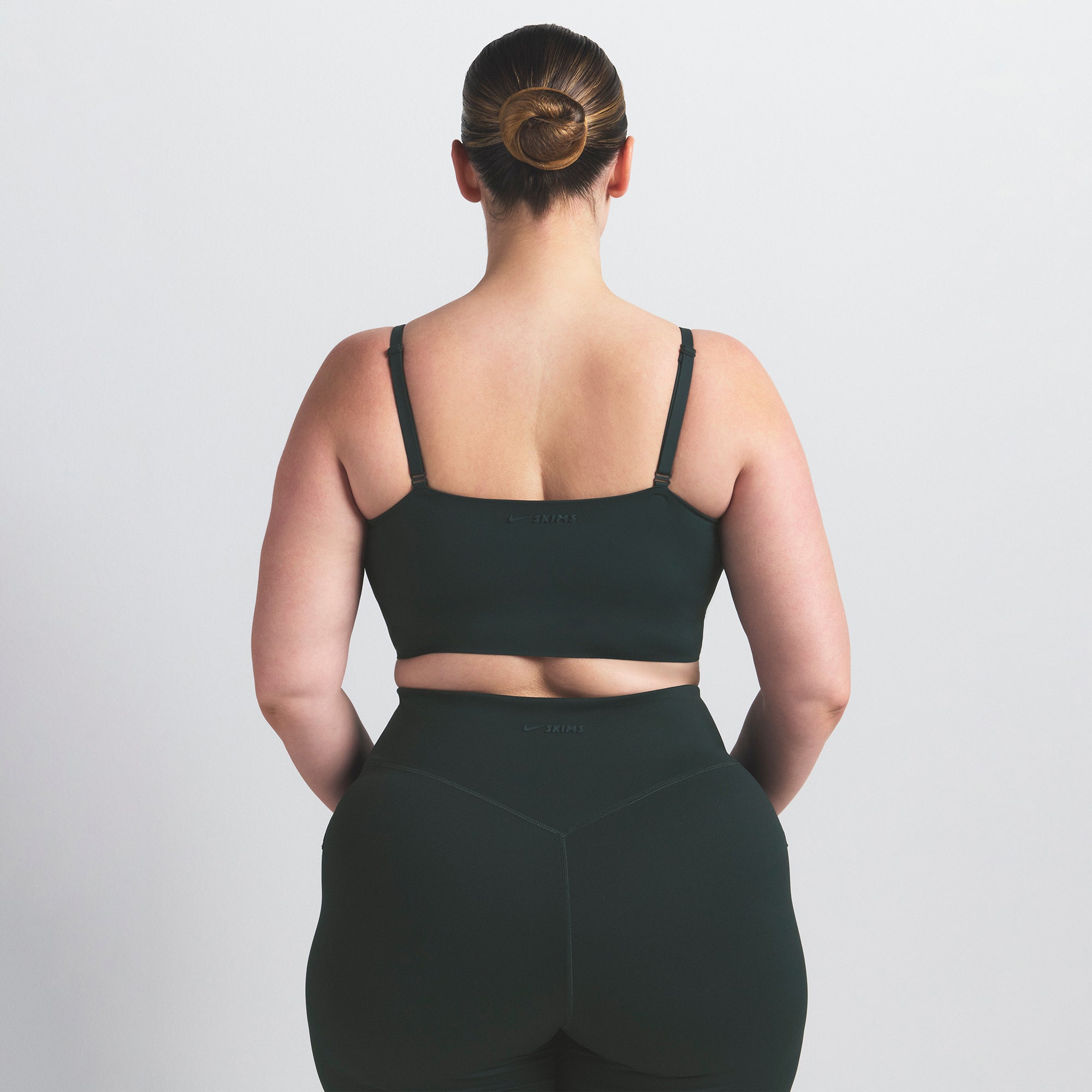 NikeSKIMS MATTE CAMI BRA TOP | DARK TEAL ON A MODEL SIDE VIEW @ | FOCUS: 0.0, 1.0, 0.9