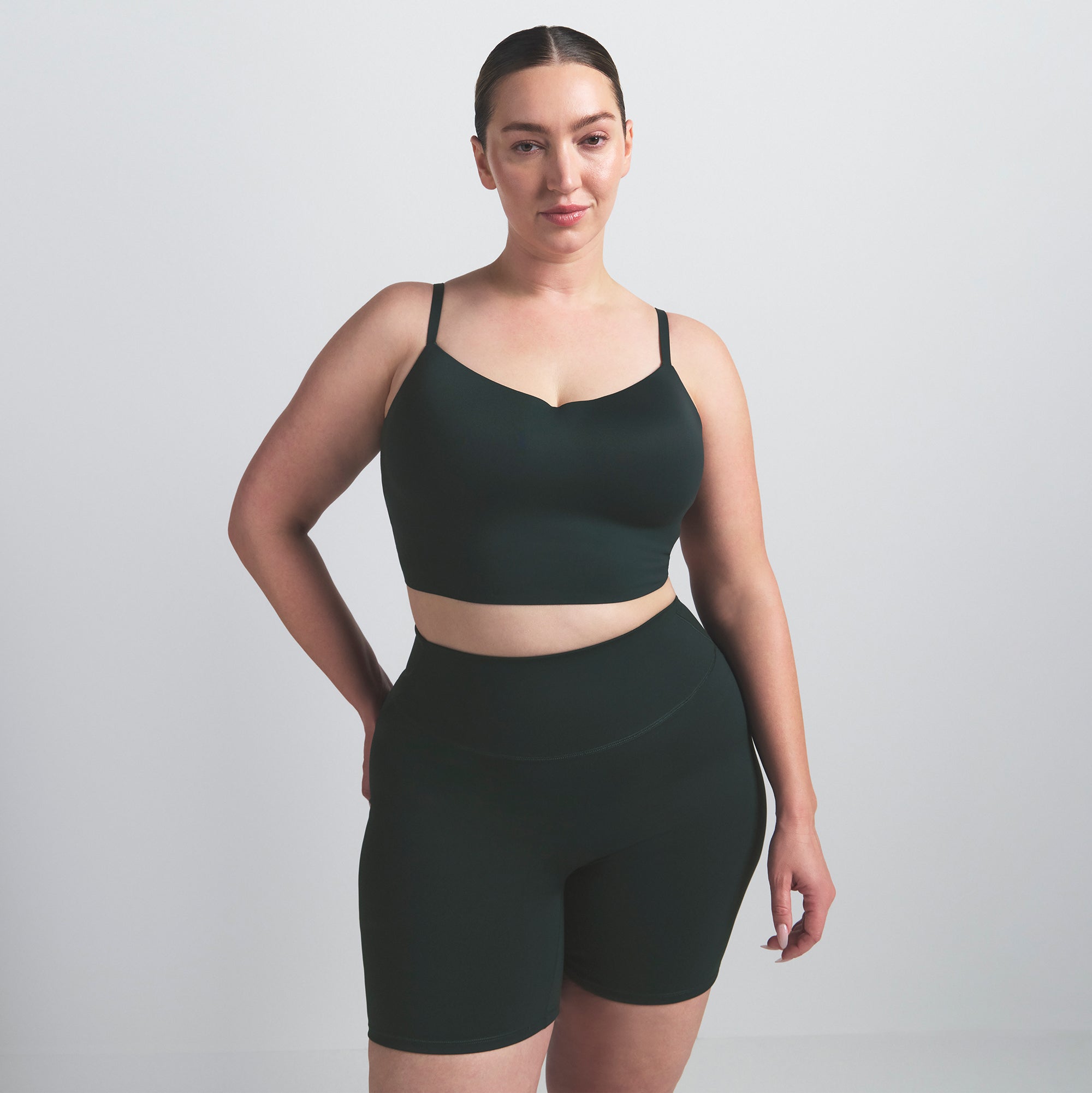 NikeSKIMS MATTE CAMI BRA TOP | DARK TEAL ON A MODEL SIDE VIEW @ | FOCUS: 0.0, 1.0, 0.9