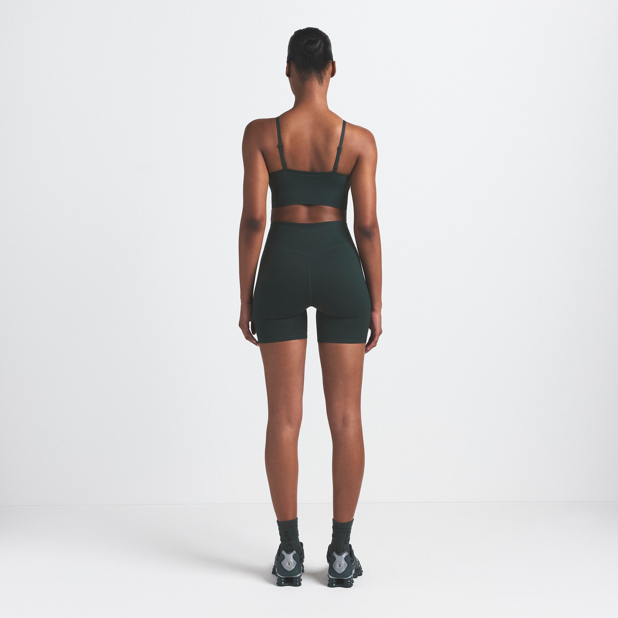 NikeSKIMS MATTE CAMI BRA TOP | DARK TEAL ON A MODEL SIDE VIEW @ | FOCUS: 0.0, 1.0, 0.9