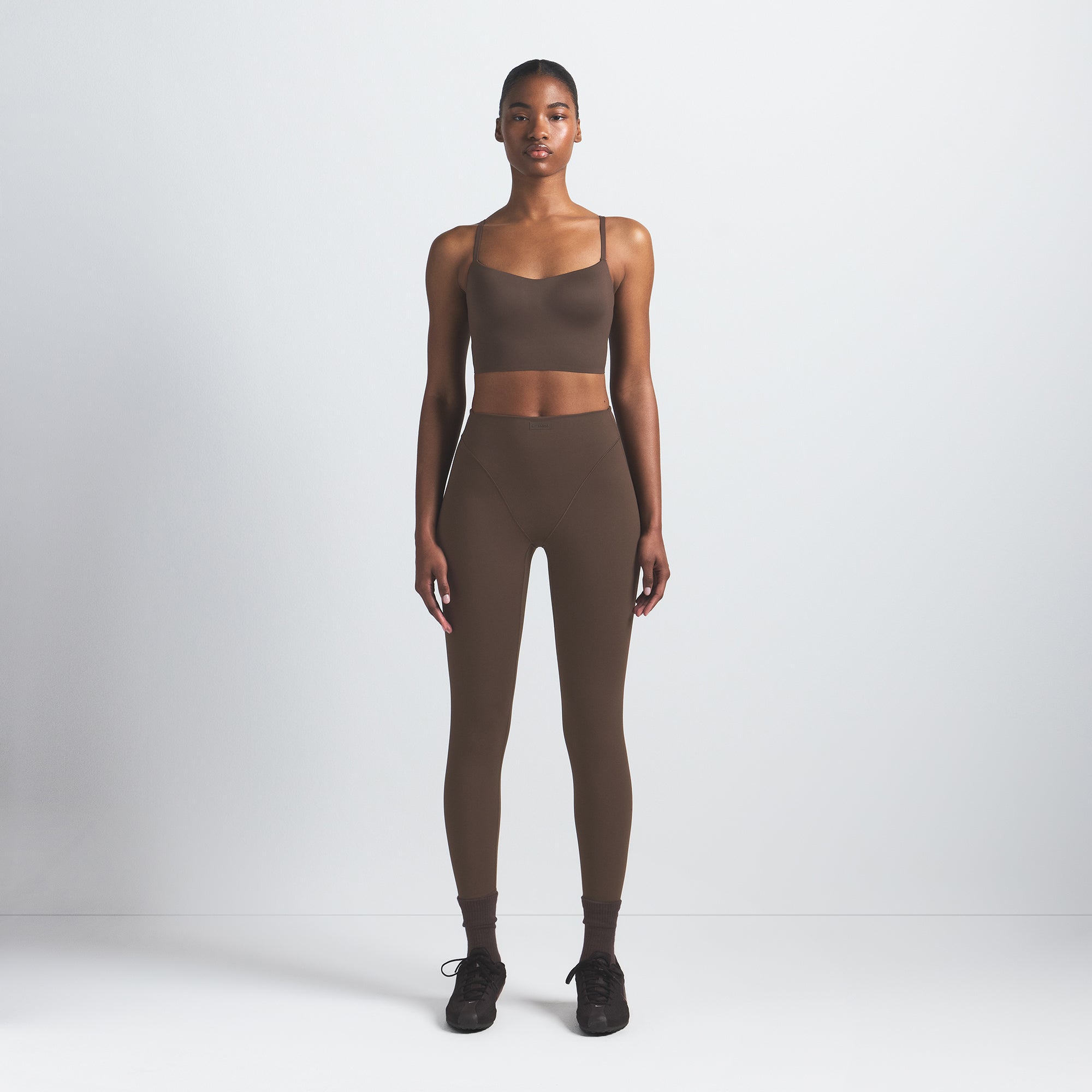 NikeSKIMS MATTE CAMI BRA TOP | DARK SEPIA ON A MODEL FRONT VIEW