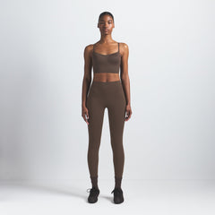 NikeSKIMS MATTE CAMI BRA TOP | DARK SEPIA ON A MODEL FRONT VIEW