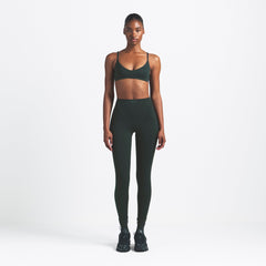 NikeSKIMS MATTE MICRO SCOOP BRA | DARK TEAL ON A MODEL FRONT VIEW @ | FOCUS: 0.0, 1.0, 0.9
