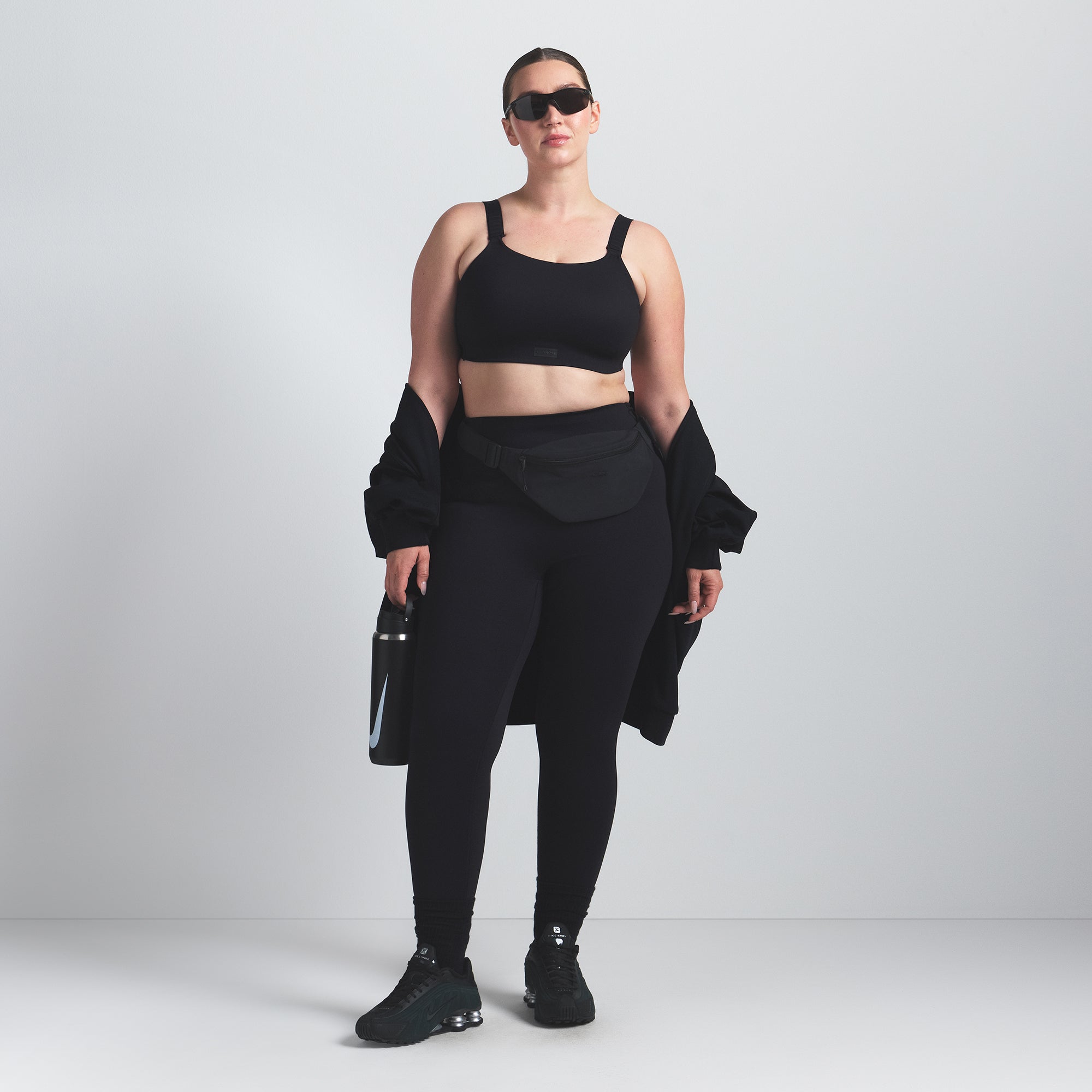 NikeSKIMS MATTE WIDE STRAP BRA | OBSIDIAN ON A MODEL FRONT VIEW @ | FOCUS: 0.0, 1.0, 0.9
