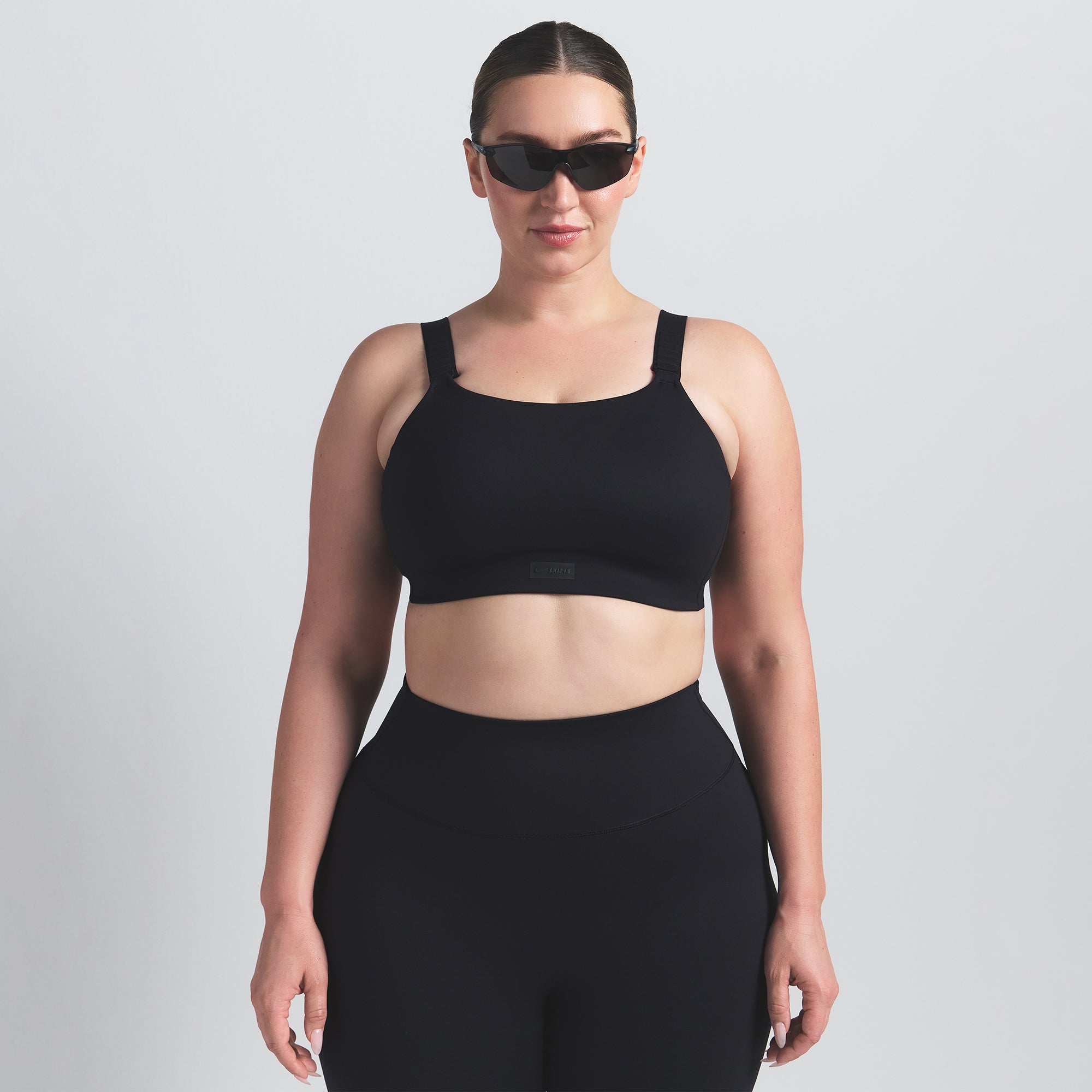 NikeSKIMS MATTE WIDE STRAP BRA | OBSIDIAN ON A MODEL FRONT VIEW @ | FOCUS: 0.0, 1.0, 0.9