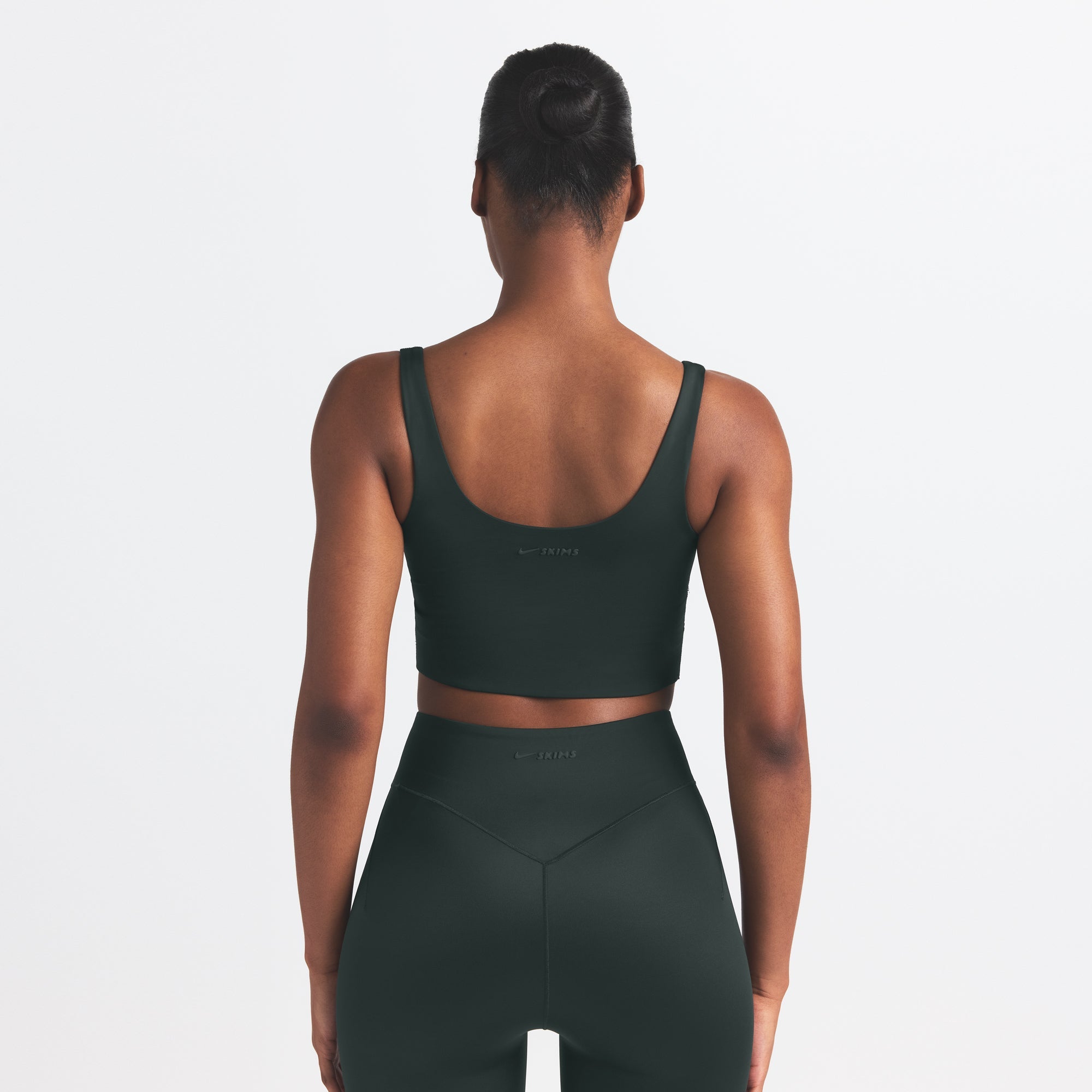 NikeSKIMS SHINE SCOOP NECK BRA TOP | DARK TEAL ON A MODEL SIDE VIEW @ | FOCUS: 0.0, 1.0, 0.9