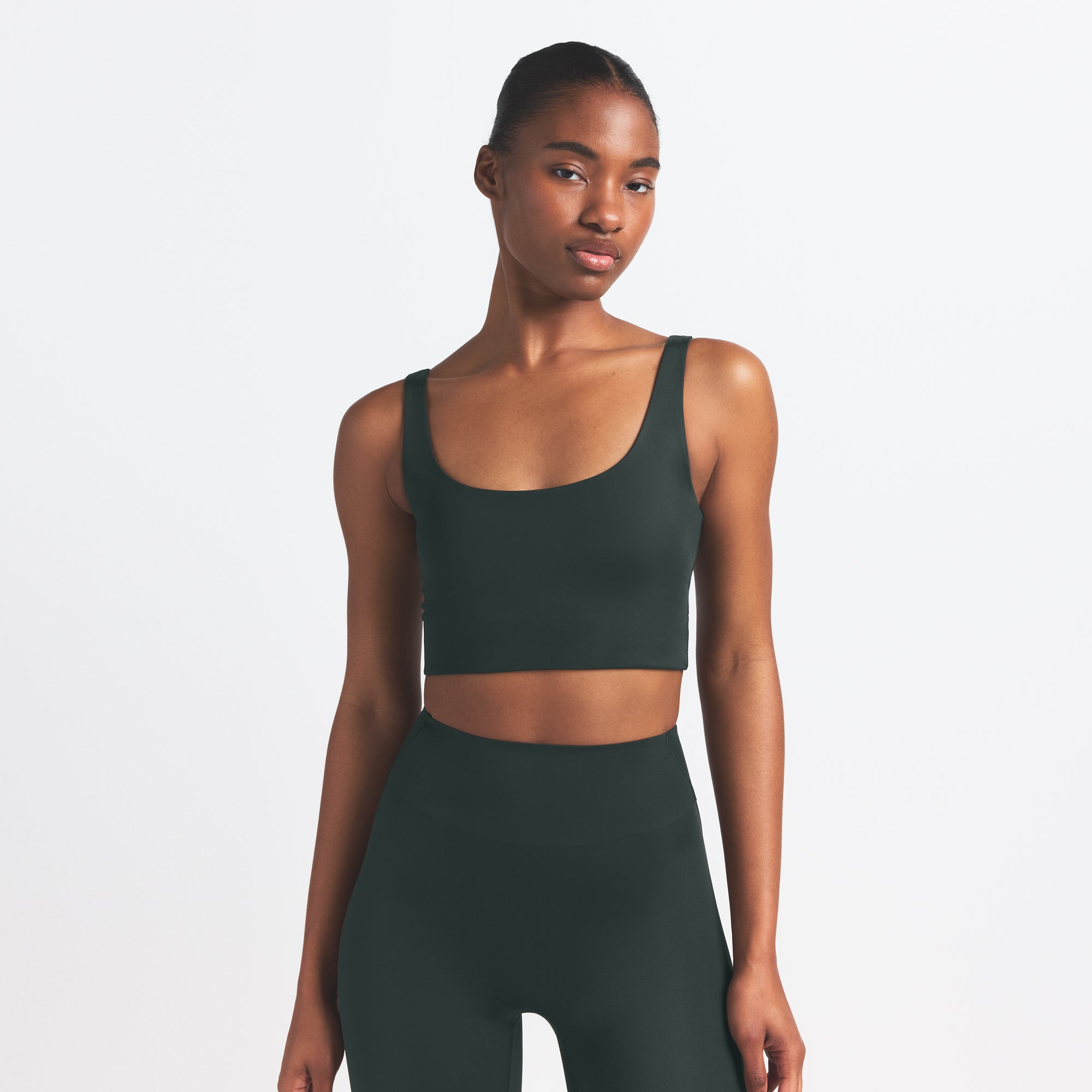 NikeSKIMS SHINE SCOOP NECK BRA TOP | DARK TEAL ON A MODEL SIDE VIEW @ | FOCUS: 0.0, 1.0, 0.9