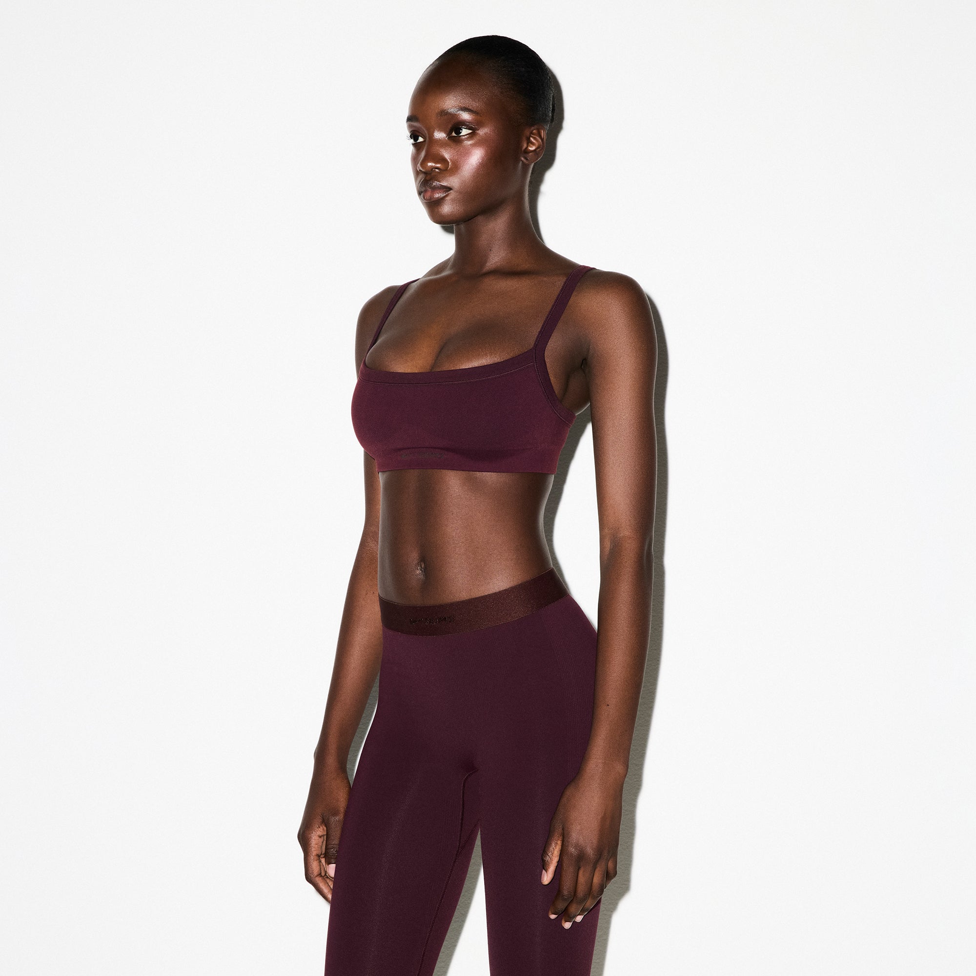 NikeSKIMS VINTAGE SEAMLESS CAMI BRA | CURRANT ON A MODEL FRONT VIEW @ | FOCUS: 0.0, 1.0, 0.9