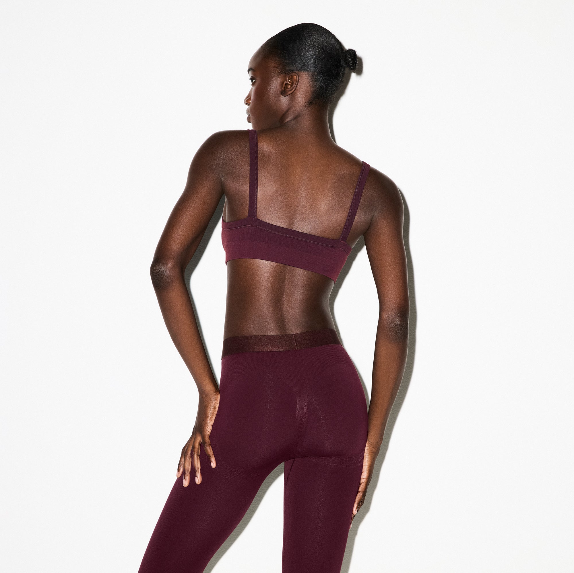 NikeSKIMS VINTAGE SEAMLESS CAMI BRA | CURRANT ON A MODEL FRONT VIEW @ | FOCUS: 0.0, 1.0, 0.9