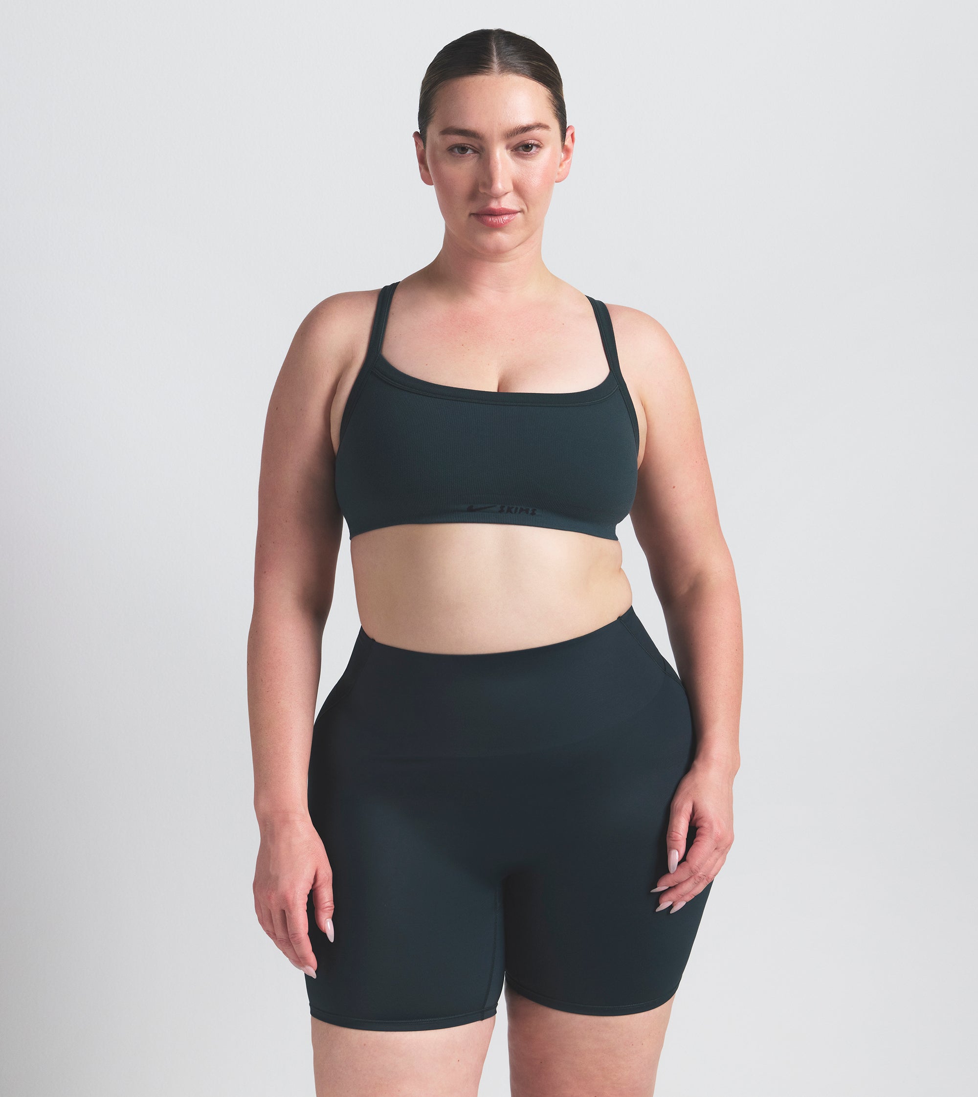 NikeSKIMS VINTAGE SEAMLESS CAMI BRA | DARK TEAL ON A MODEL SIDE VIEW @ | FOCUS: 0.0, 1.0, 0.9