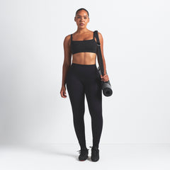 NikeSKIMS VINTAGE SEAMLESS CAMI BRA | OBSIDIAN ON A MODEL FRONT VIEW @ | FOCUS: 0.9, 0.1, 0.7