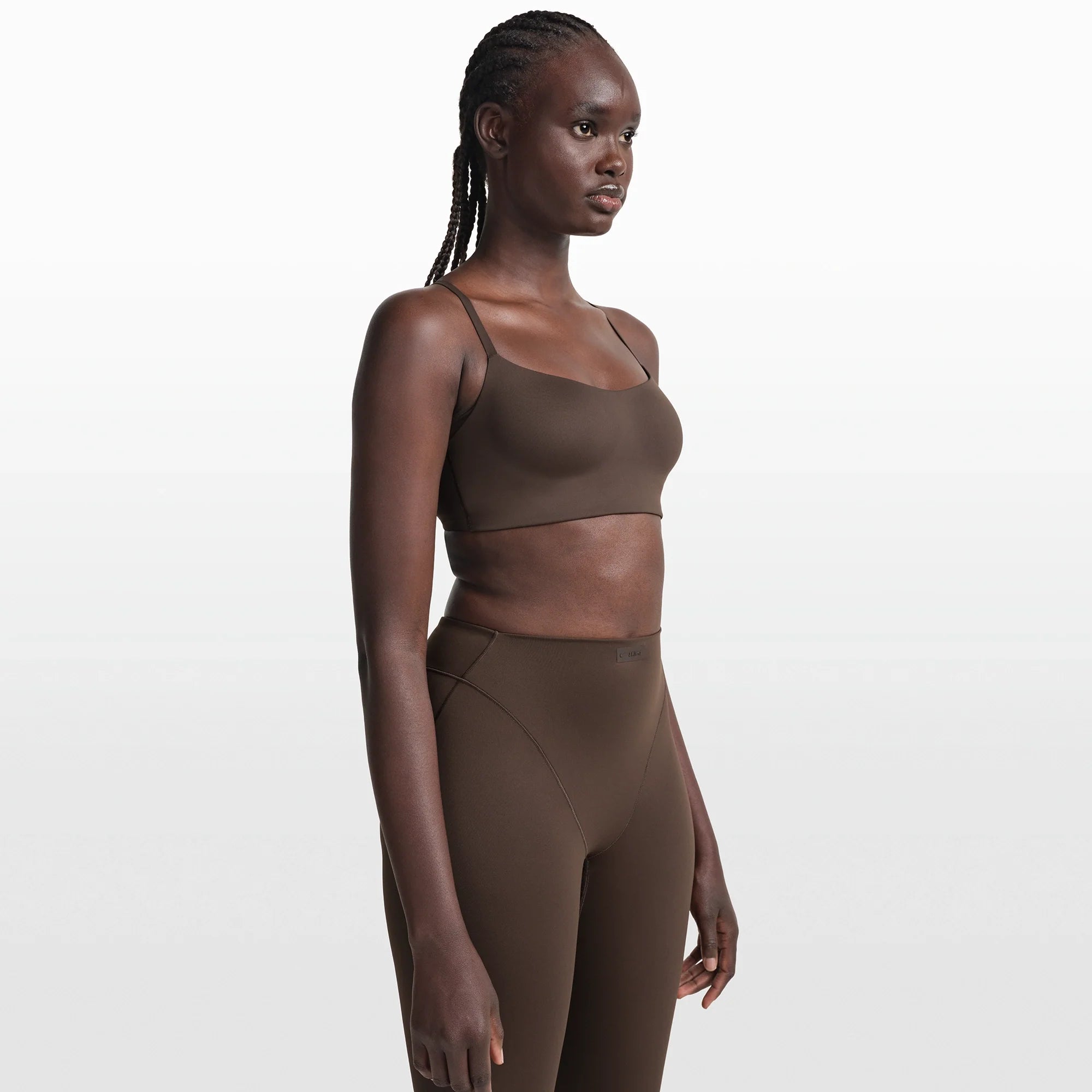 NikeSKIMS MATTE CONTOUR CAMI BRA | DARK SEPIA ON A MODEL FRONT VIEW @ | FOCUS: 0.0, 1.0, 0.9
