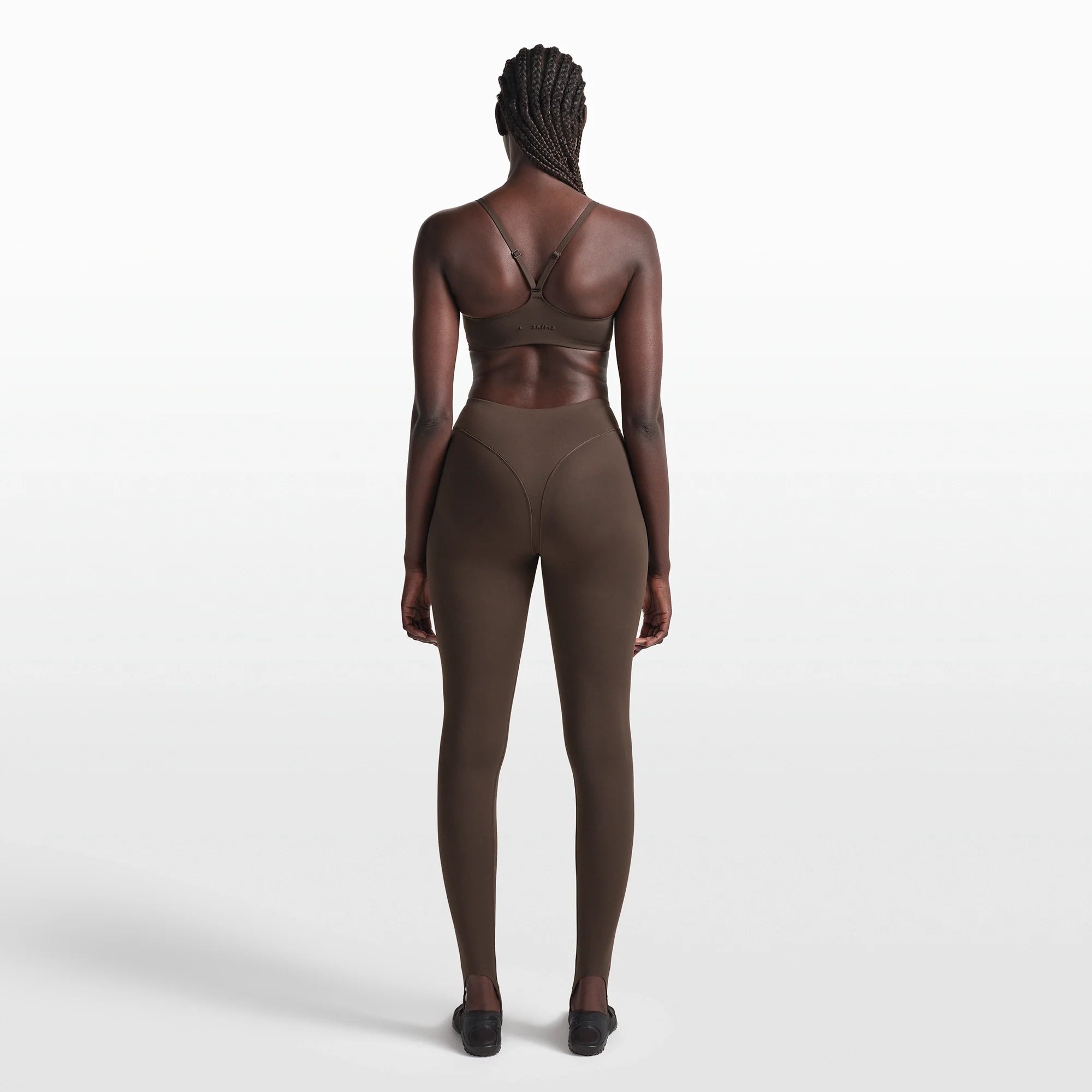 NikeSKIMS MATTE CONTOUR CAMI BRA | DARK SEPIA ON A MODEL FRONT VIEW @ | FOCUS: 0.0, 1.0, 0.9