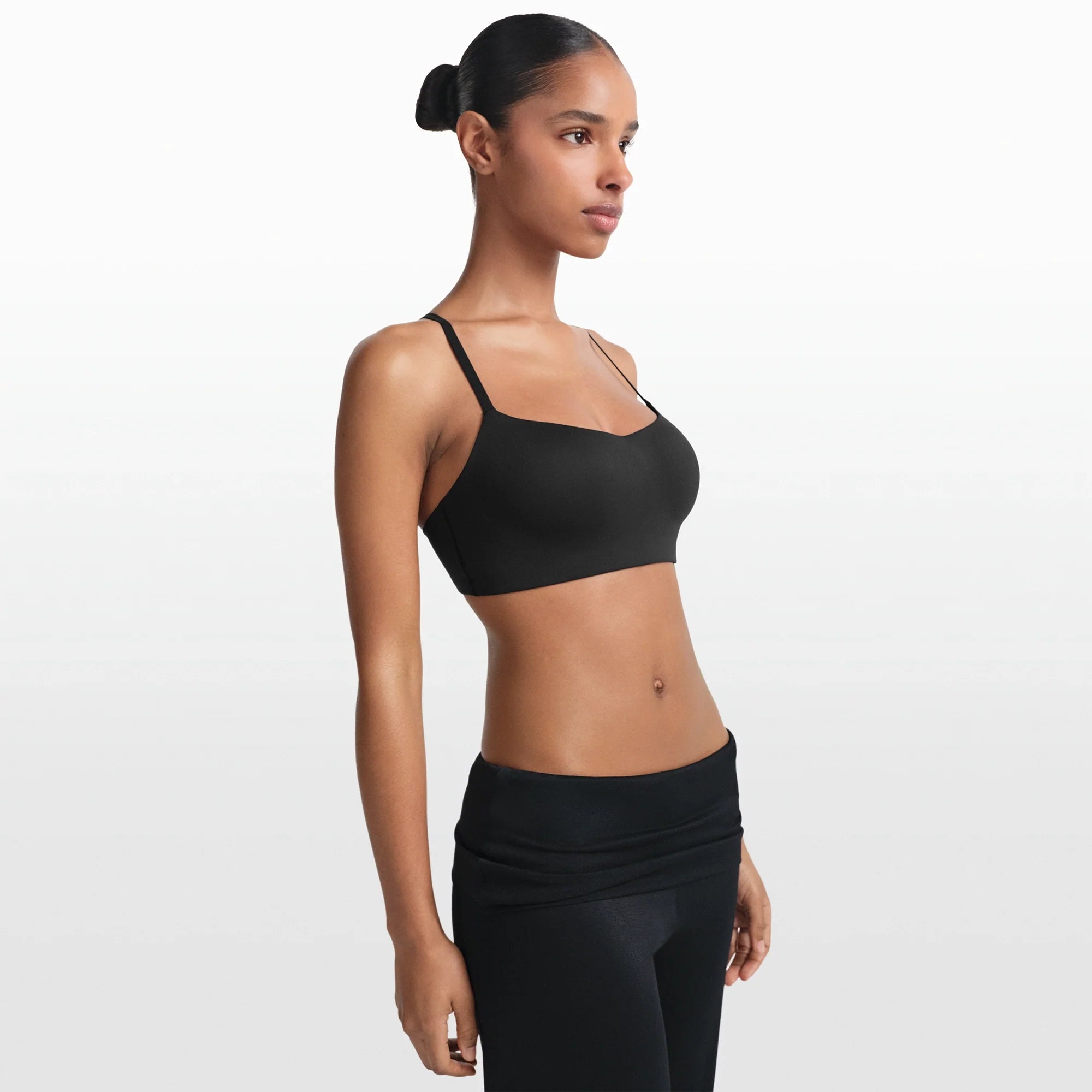 NikeSKIMS MATTE CONTOUR CAMI BRA | OBSIDIAN ON A MODEL FRONT VIEW @ | FOCUS: 0.0, 1.0, 0.9