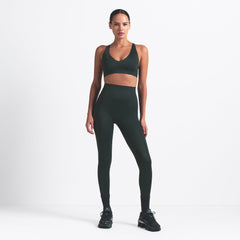 NikeSKIMS SHINE V-NECK BRA | DARK TEAL ON A MODEL FRONT VIEW @ | FOCUS: 0.0, 1.0, 0.9