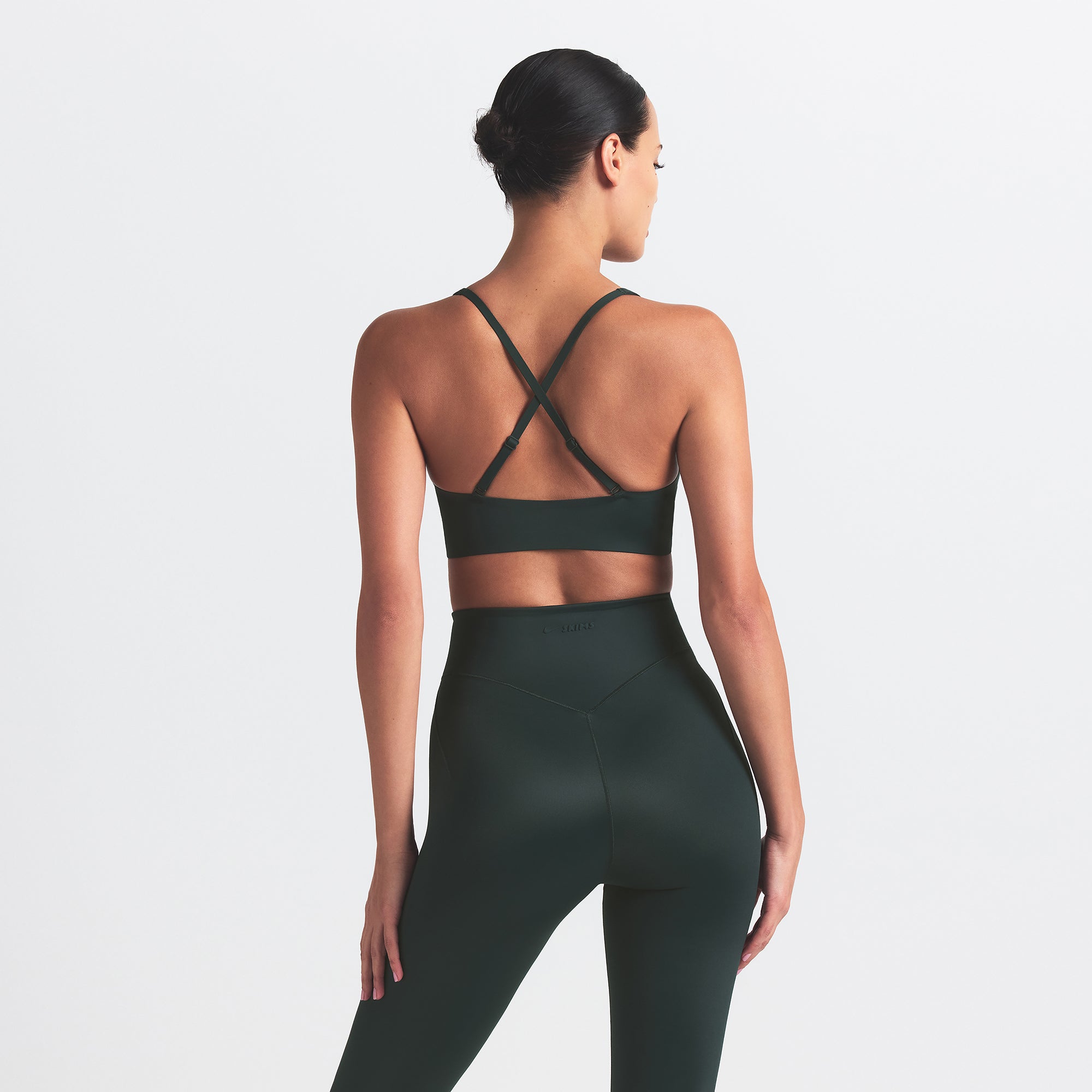 NikeSKIMS SHINE V-NECK BRA | DARK TEAL ON A MODEL SIDE VIEW @ | FOCUS: 0.0, 1.0, 0.9