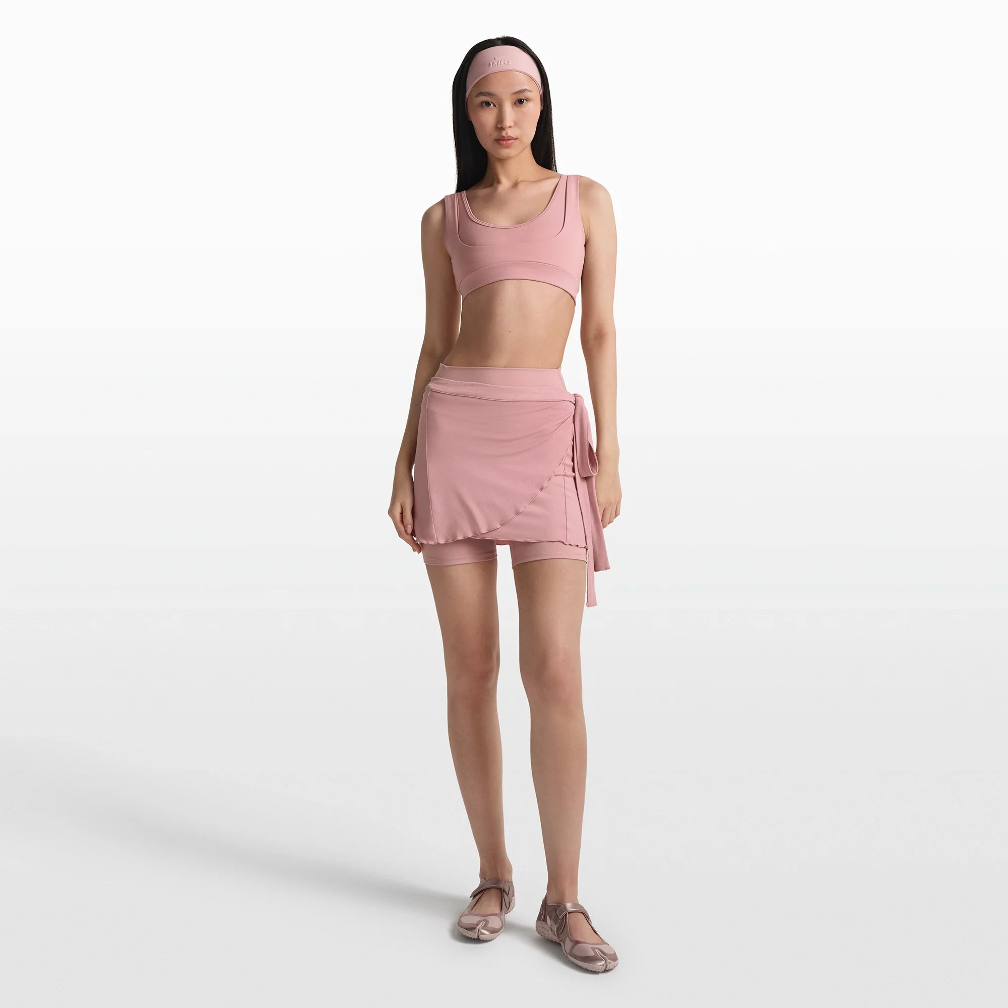 NikeSKIMS MATTE DOUBLE STRAP SCOOP BRA | HIMALAYAN ON A MODEL FRONT VIEW @ | FOCUS: 0.0, 1.0, 0.9