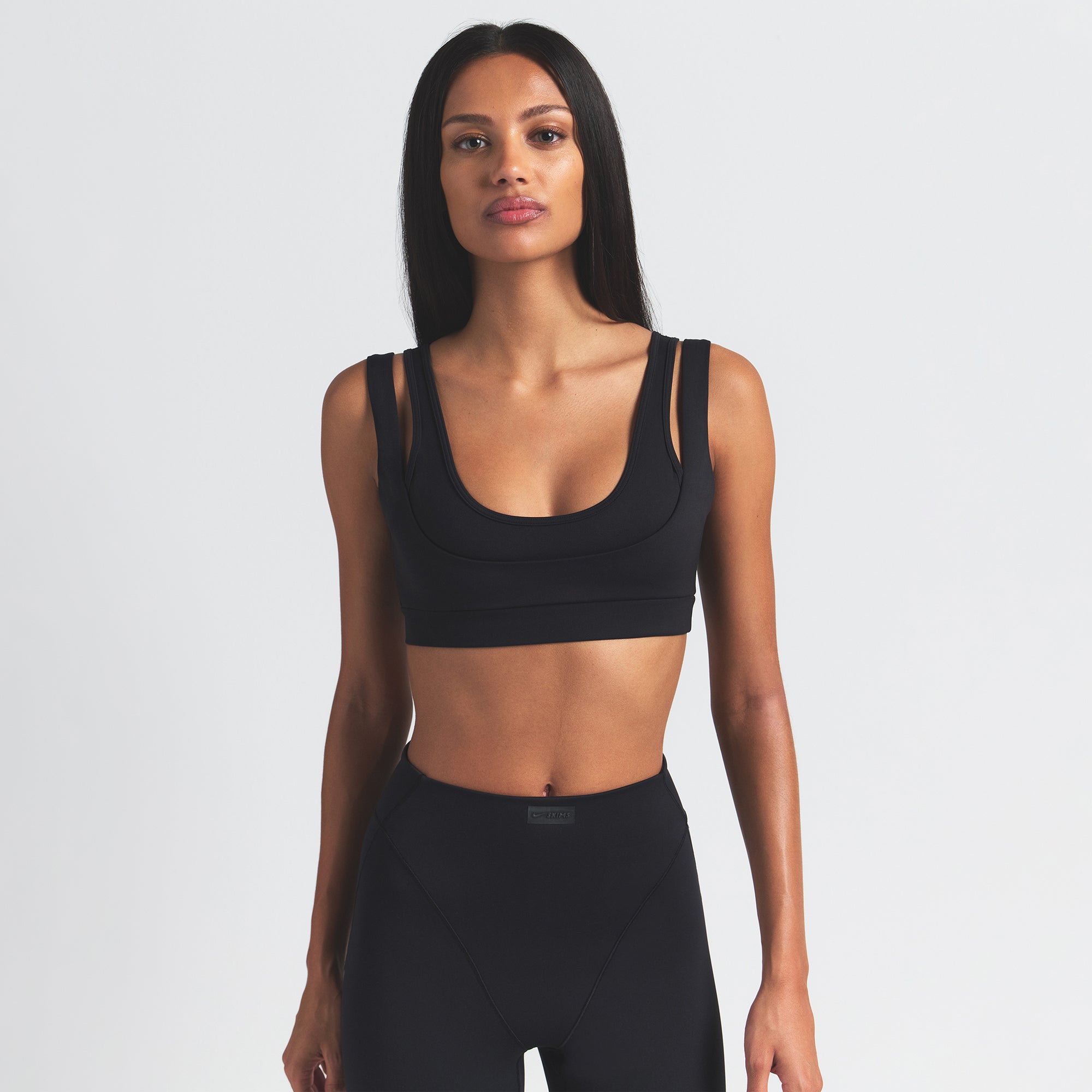 NikeSKIMS MATTE DOUBLE STRAP SCOOP BRA | OBSIDIAN ON A MODEL FRONT VIEW @ | FOCUS: 0.0, 1.0, 0.9