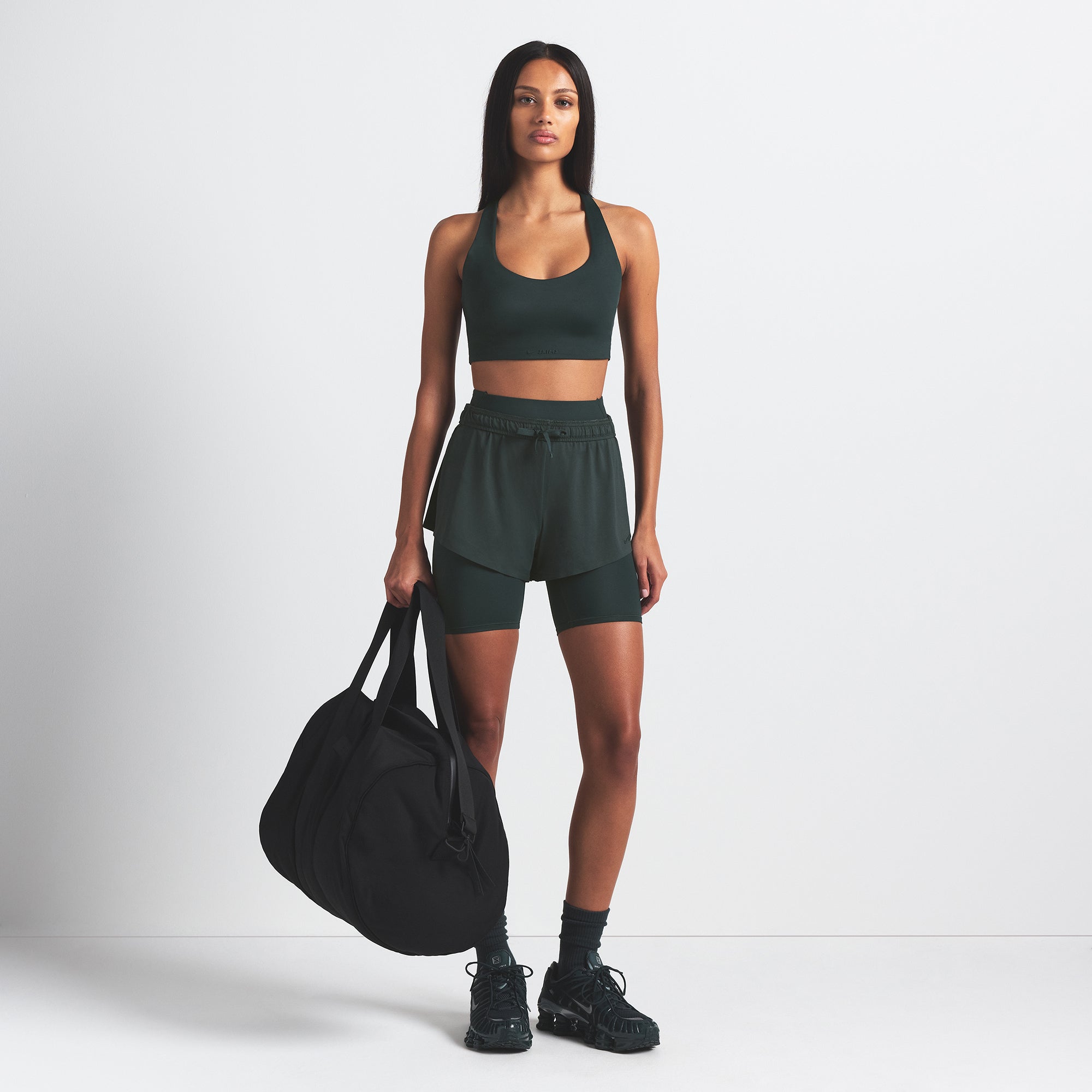 NikeSKIMS SHINE RACER BACK BRA | DARK TEAL ON A MODEL FRONT VIEW @ | FOCUS: 0.0, 1.0, 0.9