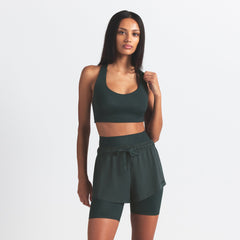 NikeSKIMS SHINE RACER BACK BRA | DARK TEAL ON A MODEL SIDE VIEW @ | FOCUS: 0.0, 1.0, 0.9