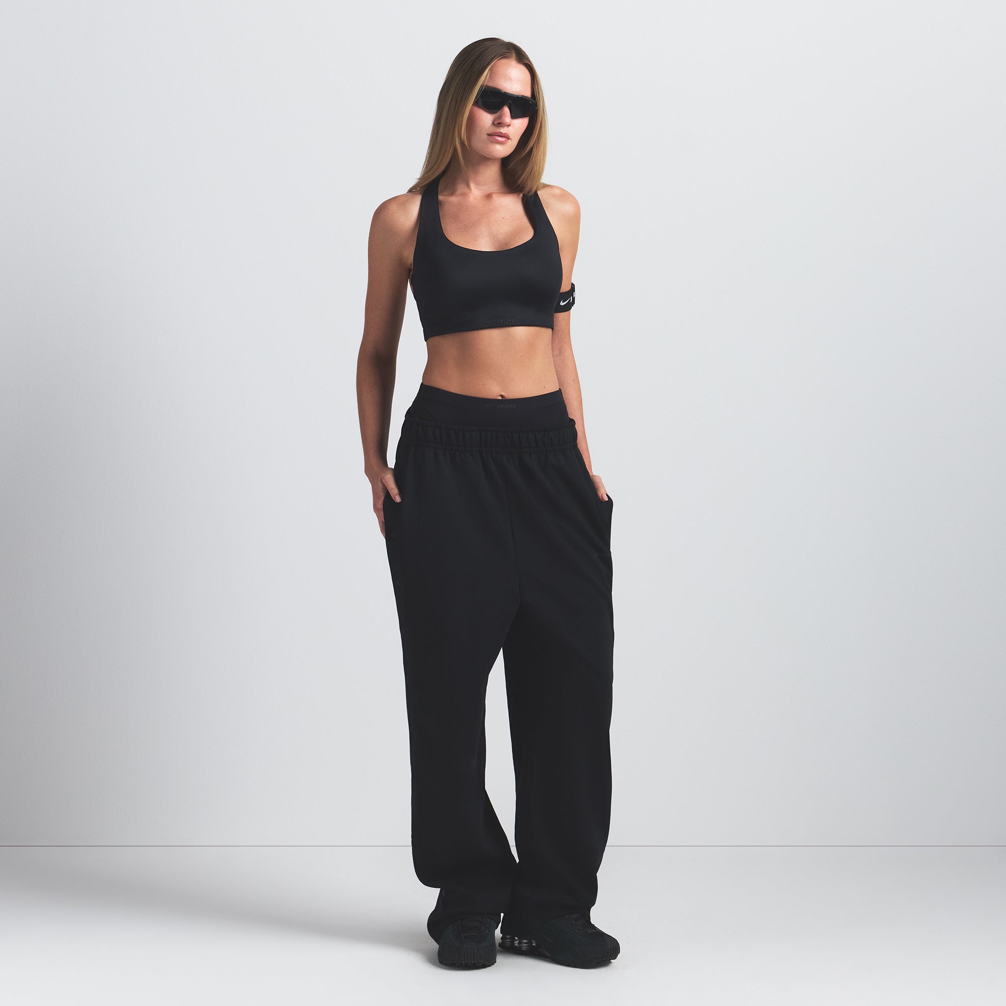 NikeSKIMS SHINE RACER BACK BRA | OBSIDIAN ON A MODEL FRONT VIEW @ | FOCUS: 0.9, 0.1, 0.7