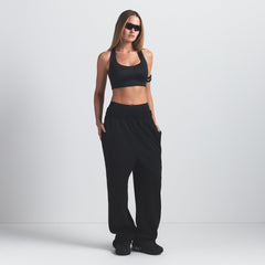 NikeSKIMS SHINE RACER BACK BRA | OBSIDIAN ON A MODEL FRONT VIEW @ | FOCUS: 0.9, 0.1, 0.7