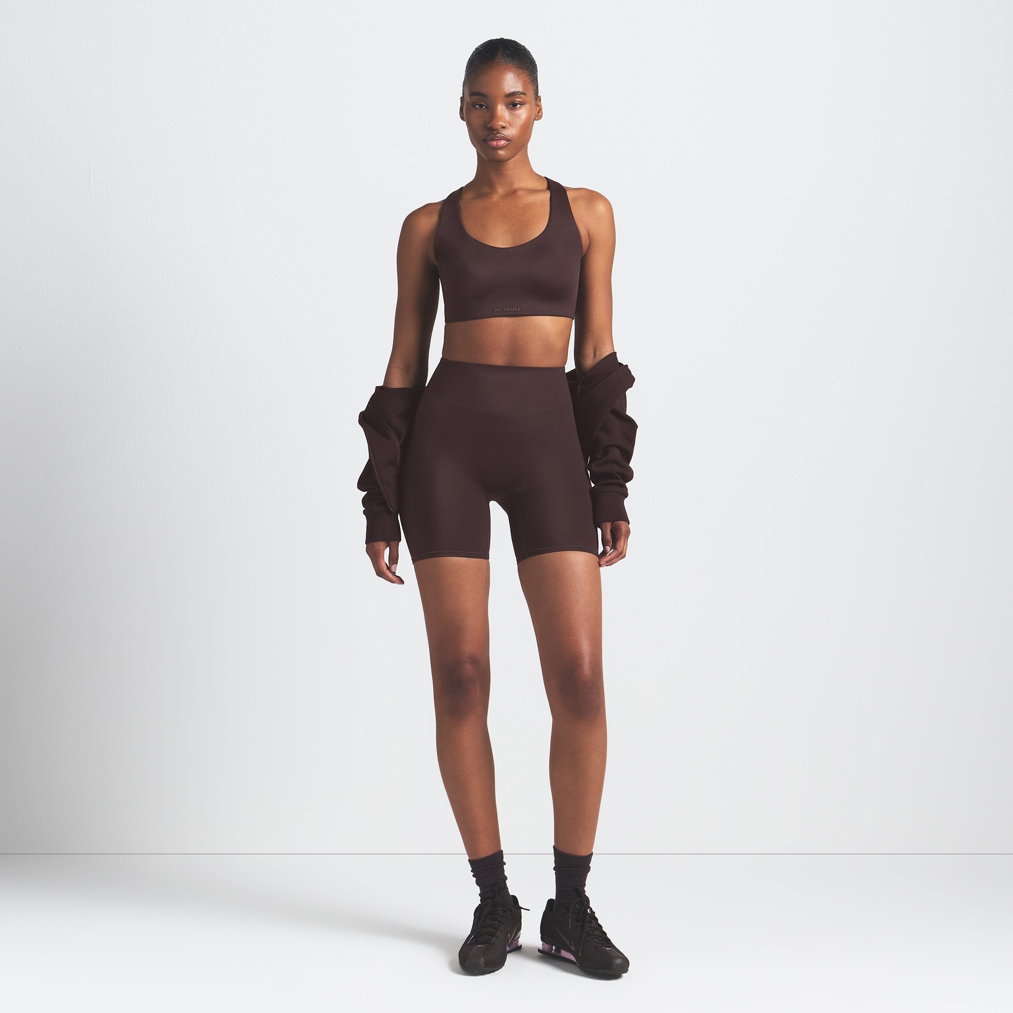 NikeSKIMS SHINE RACER BACK BRA | PHOENIX ON A MODEL FRONT VIEW @ | FOCUS: 0.9, 0.1, 0.7