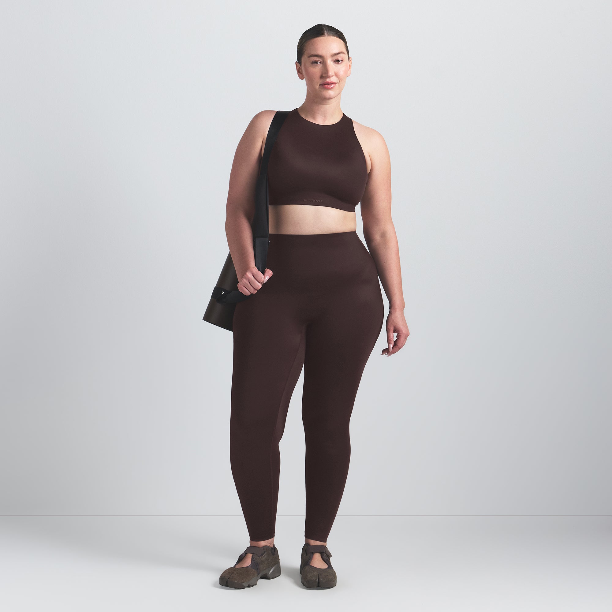 NikeSKIMS SHINE HIGH NECK BRA | PHOENIX ON A MODEL FRONT VIEW
