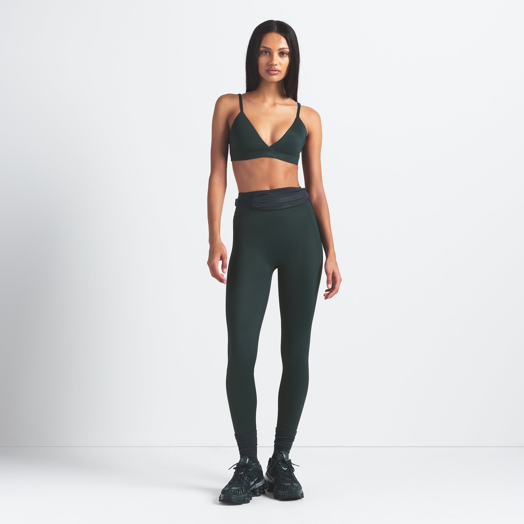 NikeSKIMS SHINE TRIANGLE BRA | DARK TEAL ON A MODEL FRONT VIEW @ | FOCUS: 0.0, 1.0, 0.9