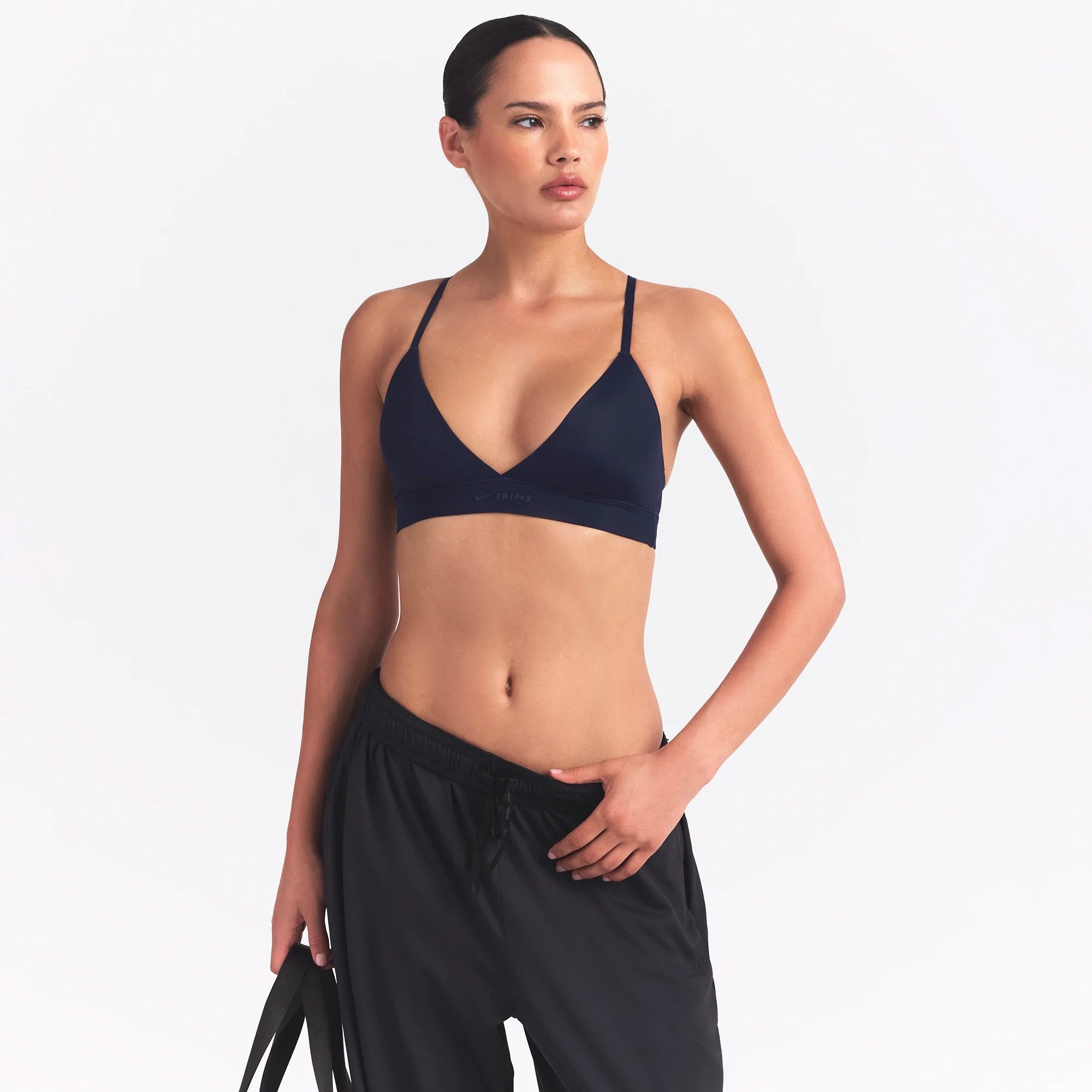 NikeSKIMS SHINE TRIANGLE BRA | NAVY ON A MODEL SIDE VIEW @ | FOCUS: 0.0, 1.0, 0.9