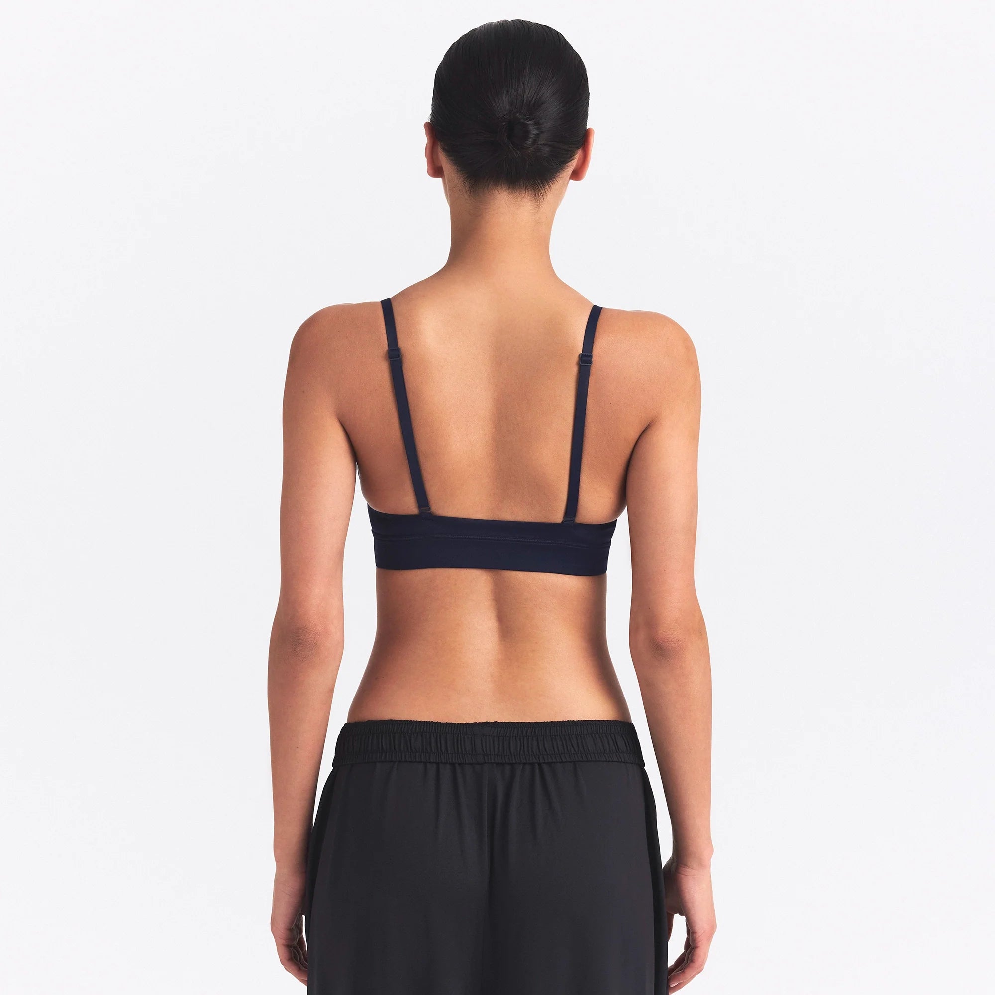 NikeSKIMS SHINE TRIANGLE BRA | NAVY ON A MODEL SIDE VIEW @ | FOCUS: 0.0, 1.0, 0.9