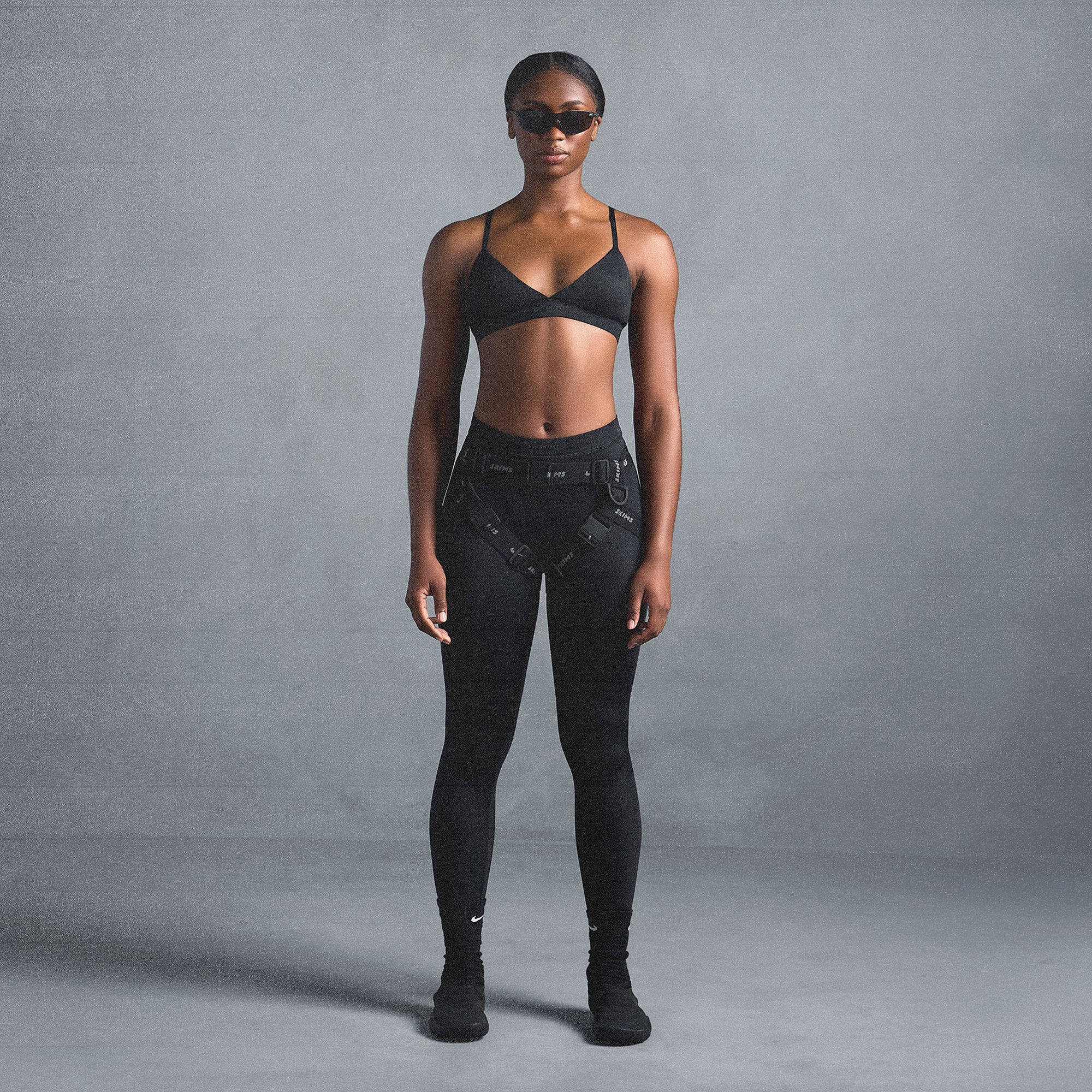 NikeSKIMS SHINE TRIANGLE BRA | OBSIDIAN ON A MODEL SIDE VIEW @ | FOCUS: 0.0, 1.0, 0.9
