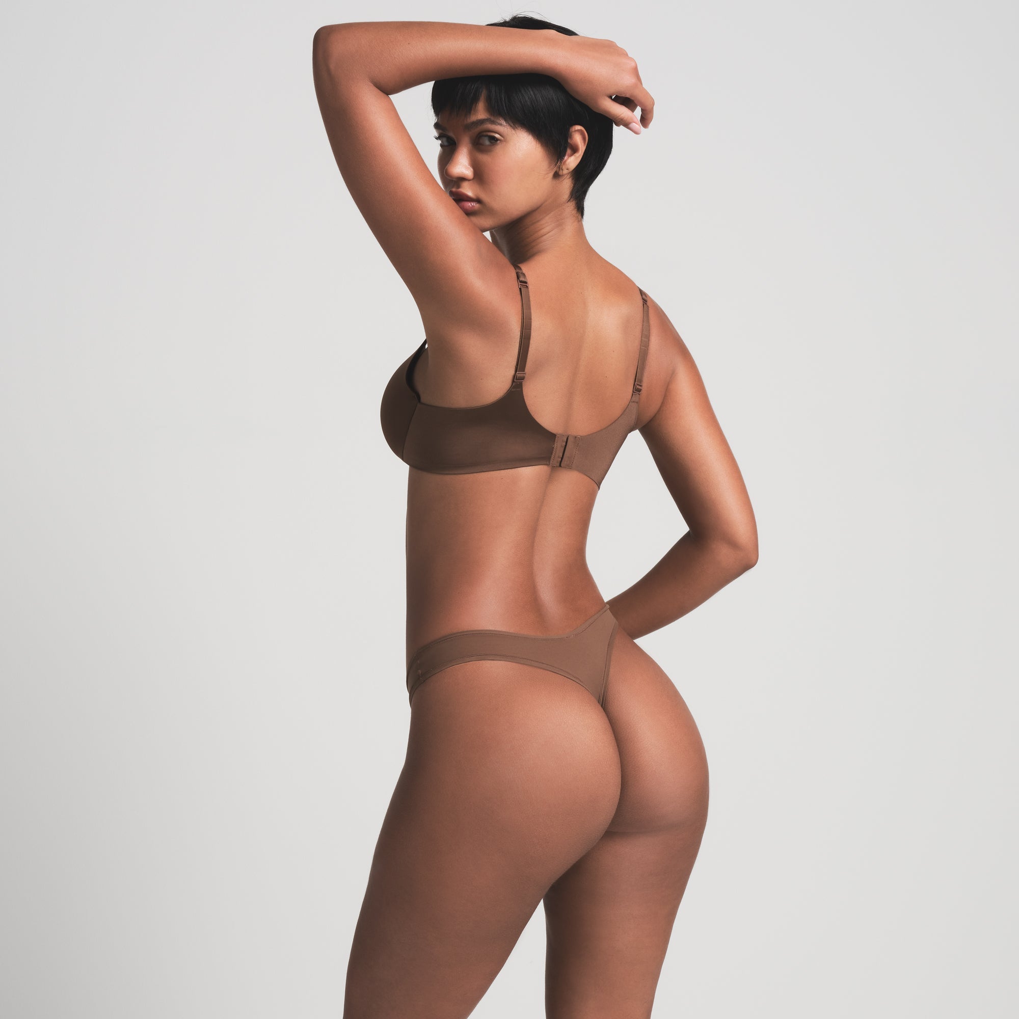 SKIMS ULTIMATE BRA IN JASPER ON A MODEL BACK VIEW | FOCUS: 0.0, 1.0, 0.9