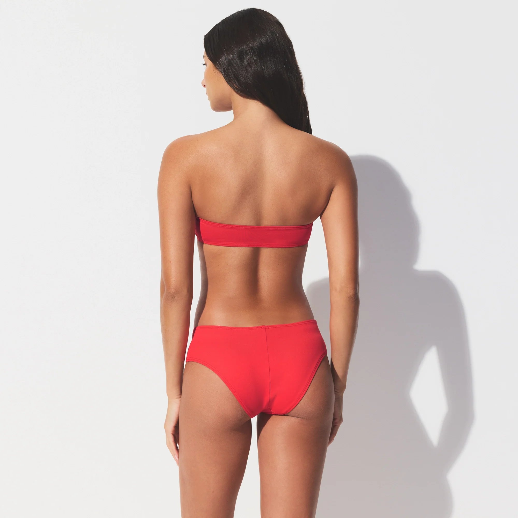 ICONIC SWIM MICRO BANDEAU BIKINI TOP | CARMINE ON A MODEL SIDE VIEW 