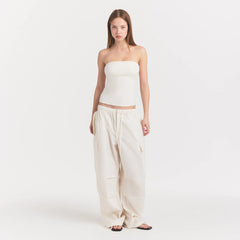 WOVEN COTTON OVERSIZED LOW RISE CARGO PANT | EGRET ON A MODEL FRONT VIEW @ | FOCUS: 0.0, 1.0, 0.9