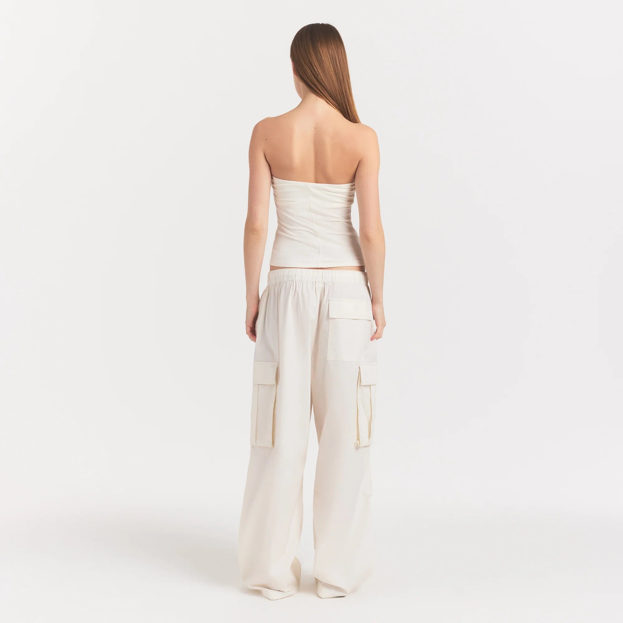 WOVEN COTTON OVERSIZED LOW RISE CARGO PANT | EGRET ON A MODEL FRONT VIEW @ | FOCUS: 0.0, 1.0, 0.9