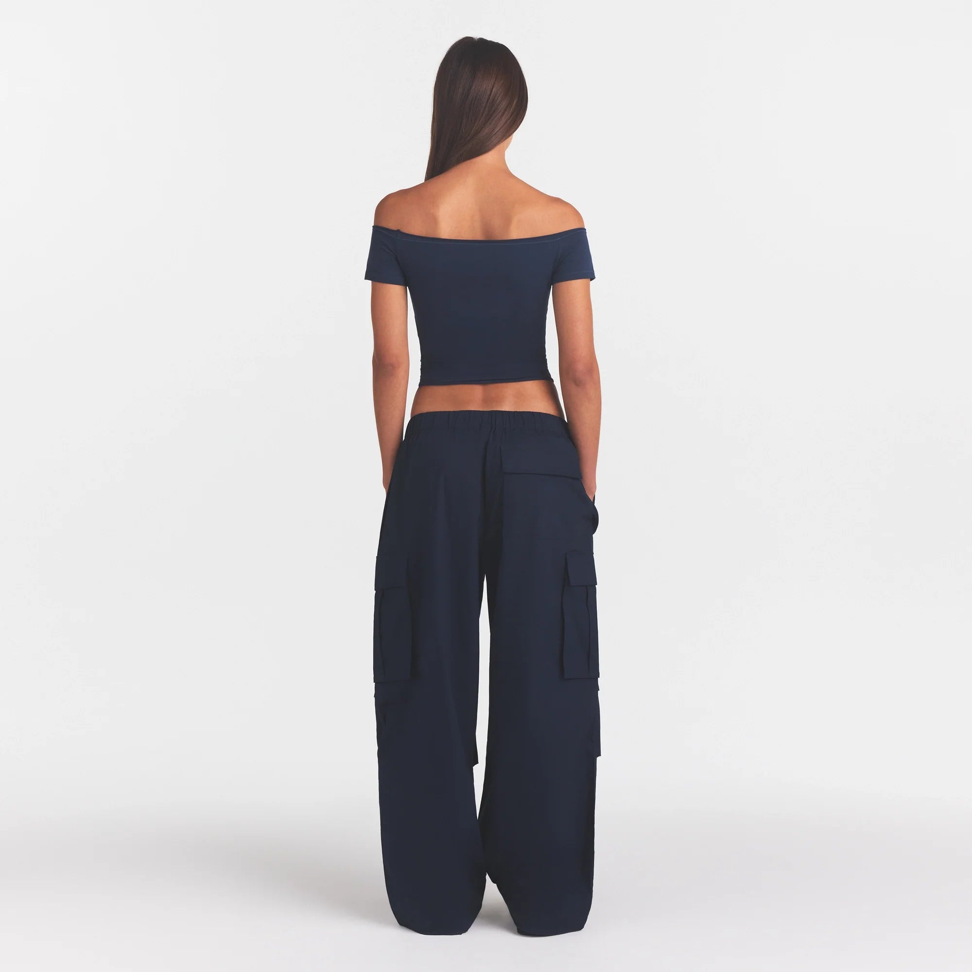 WOVEN COTTON OVERSIZED LOW RISE CARGO PANT | NAVY ON A MODEL FRONT VIEW @ | FOCUS: 0.0, 1.0, 0.9