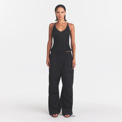 WOVEN COTTON OVERSIZED LOW RISE CARGO PANT | ONYX ON A MODEL FRONT VIEW @ | FOCUS: 0.0, 1.0, 0.9