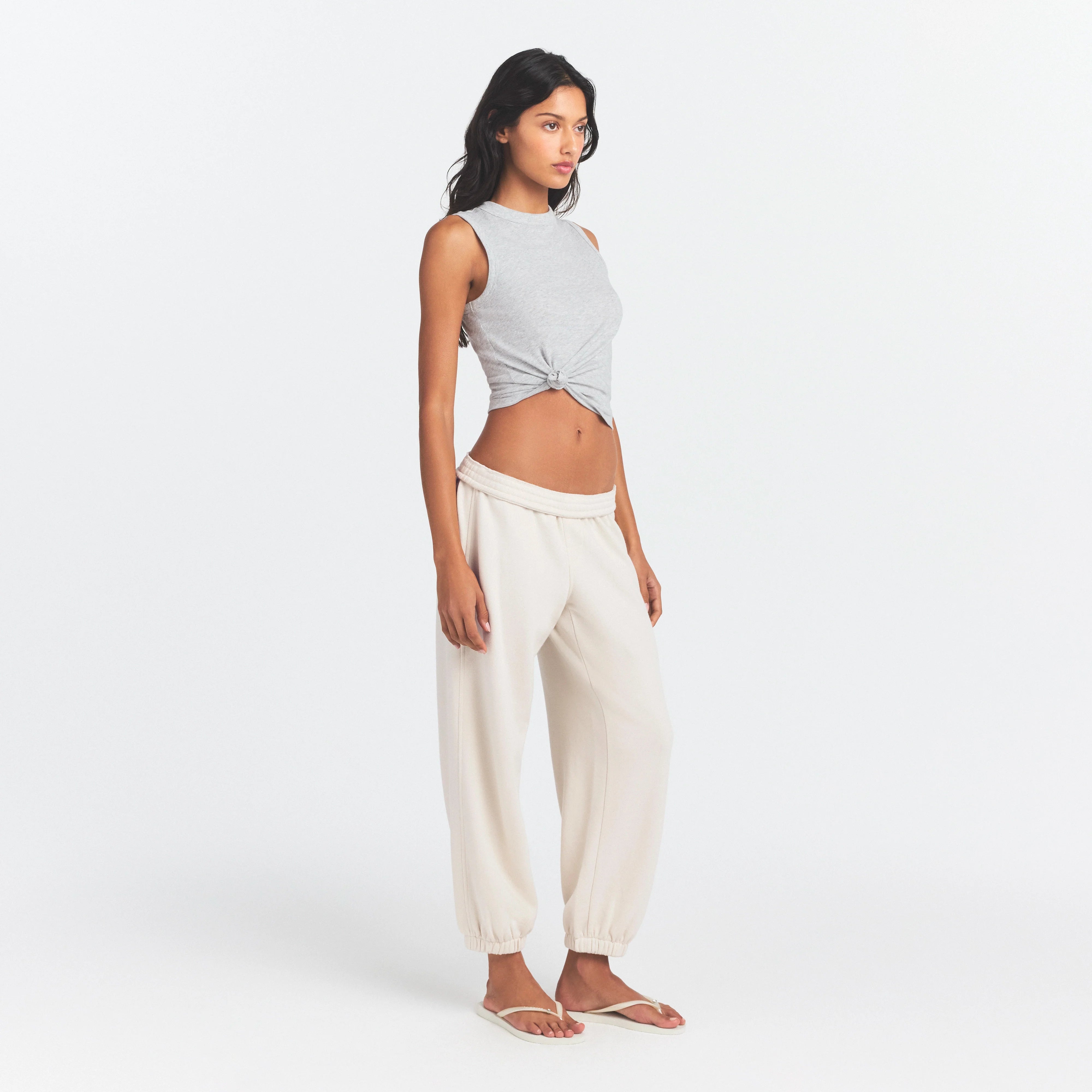 DRAPEY FRENCH TERRY CROPPED JOGGER | BUFF ON A MODEL SIDE VIEW @ | FOCUS: 0.0, 1.0, 0.9