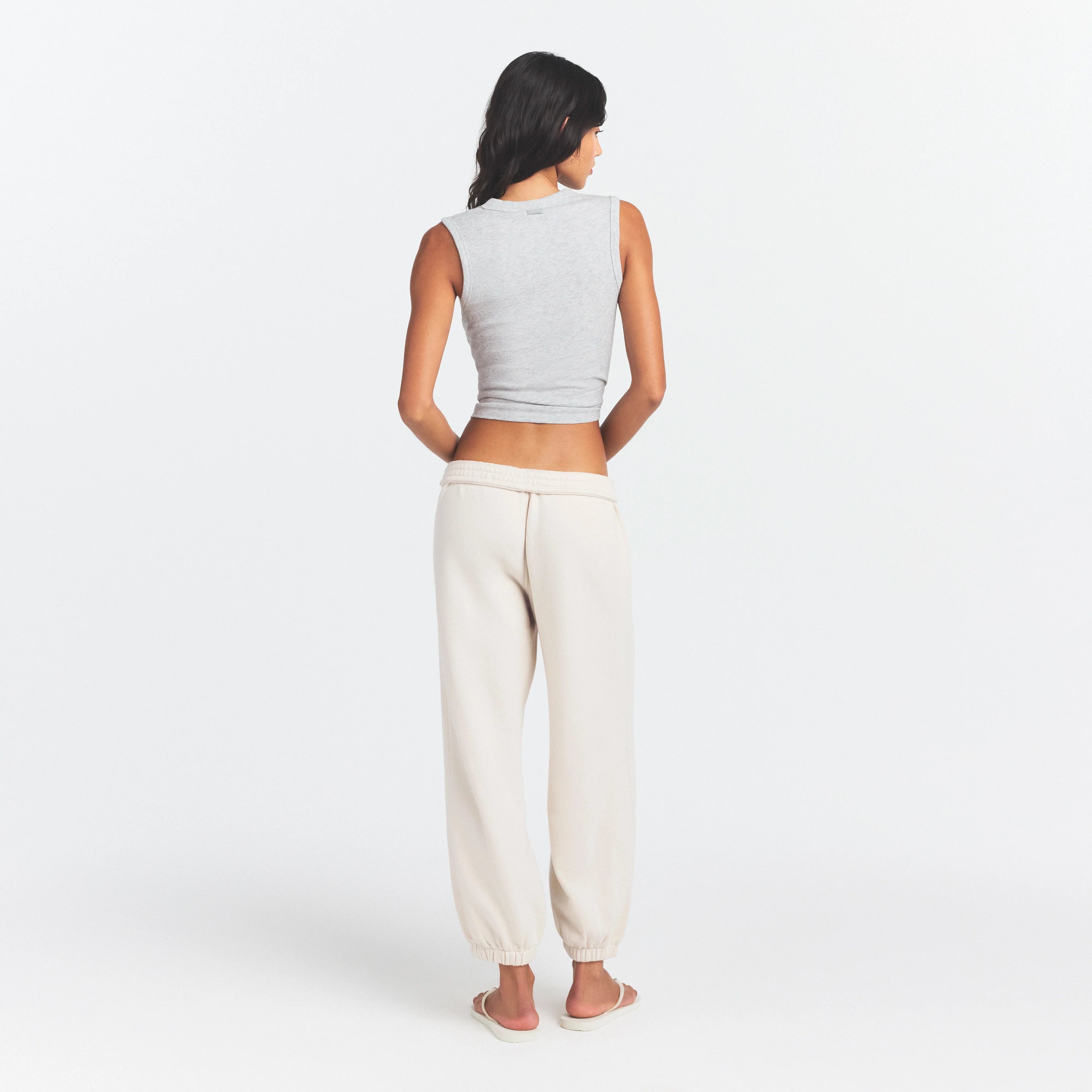 DRAPEY FRENCH TERRY CROPPED JOGGER | BUFF ON A MODEL SIDE VIEW @ | FOCUS: 0.0, 1.0, 0.9