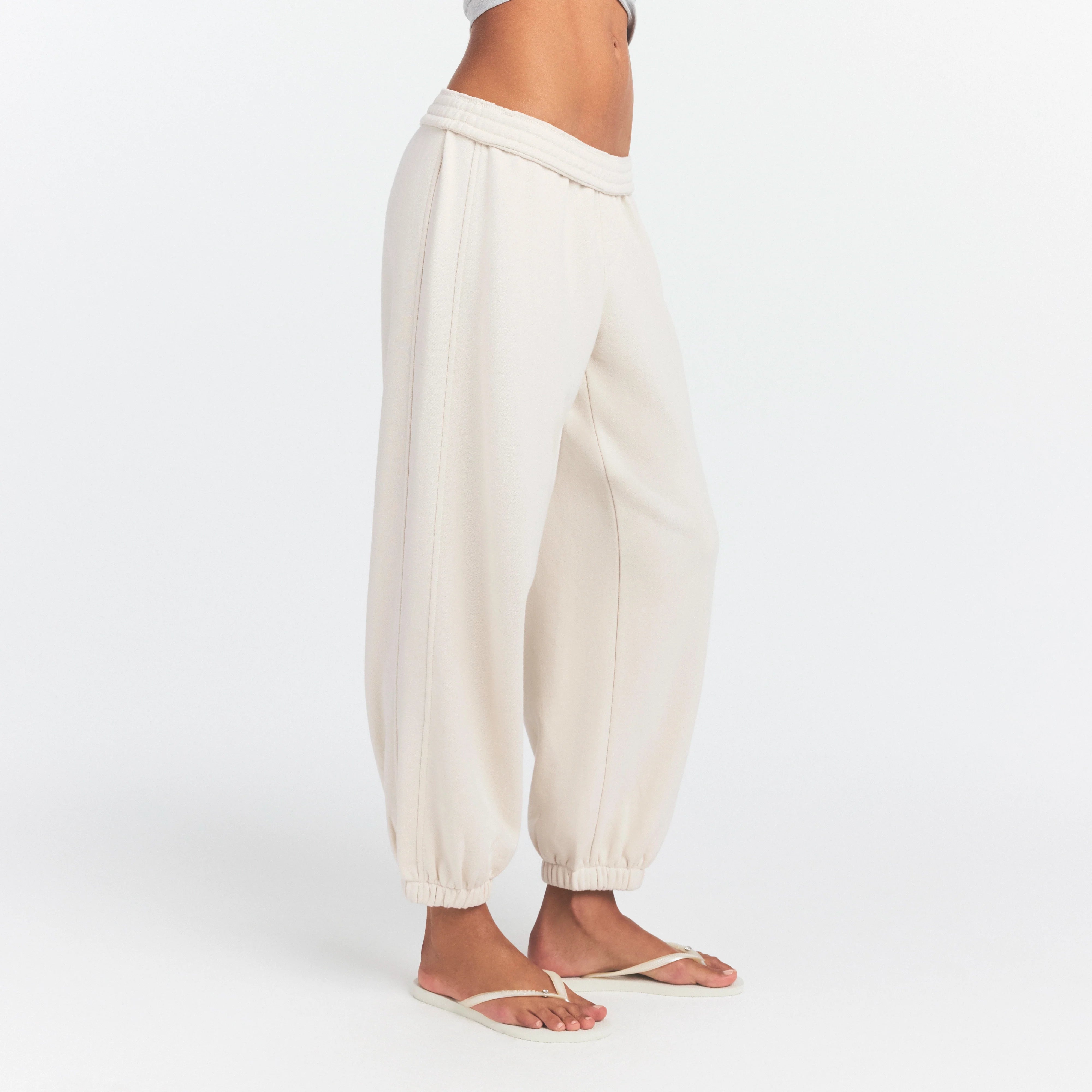 DRAPEY FRENCH TERRY CROPPED JOGGER | BUFF ON A MODEL SIDE VIEW @ | FOCUS: 0.0, 1.0, 0.9