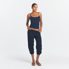 DRAPEY FRENCH TERRY CROPPED JOGGER | NAVY ON A MODEL FRONT VIEW @ | FOCUS: 0.0, 1.0, 0.9