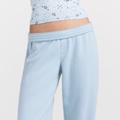 DRAPEY FRENCH TERRY CROPPED JOGGER | POWDER BLUE ON A MODEL SIDE VIEW @ | FOCUS: 0.0, 1.0, 0.9