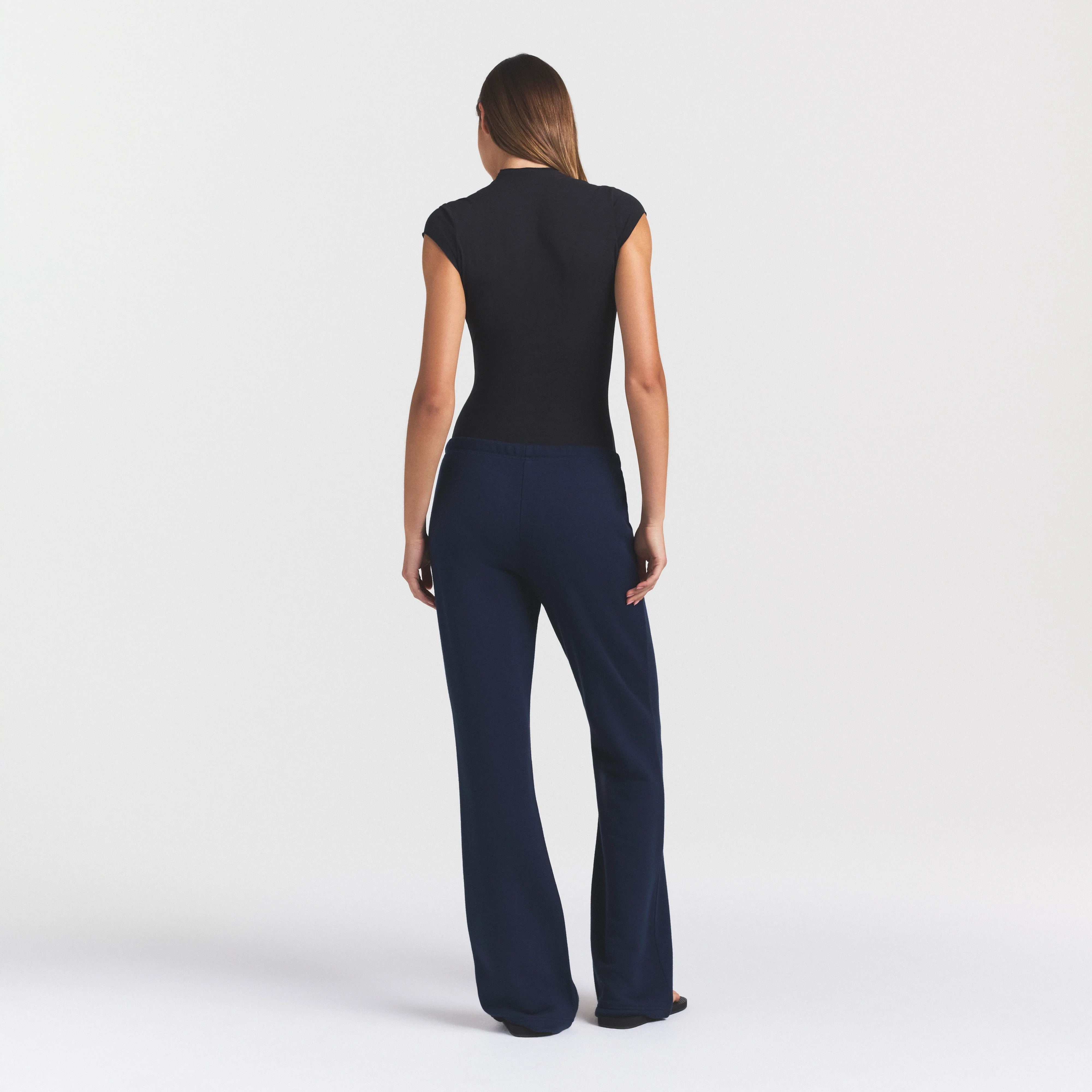 DRAPEY FRENCH TERRY STRAIGHT LEG PANT | NAVY ON A MODEL SIDE VIEW @ | FOCUS: 0.0, 1.0, 0.9