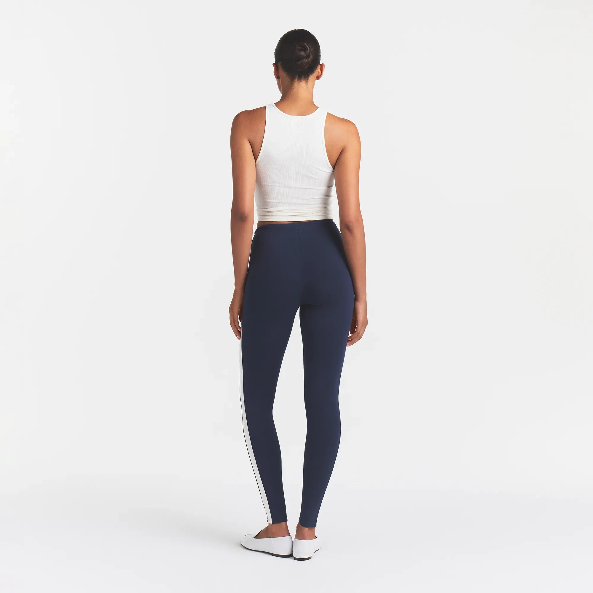 OUTDOOR HIGH-WAISTED LEGGING | NAVY ECRU CONTRAST & LAYS FLAT ON A WHITE BACKGROUND | FLT
