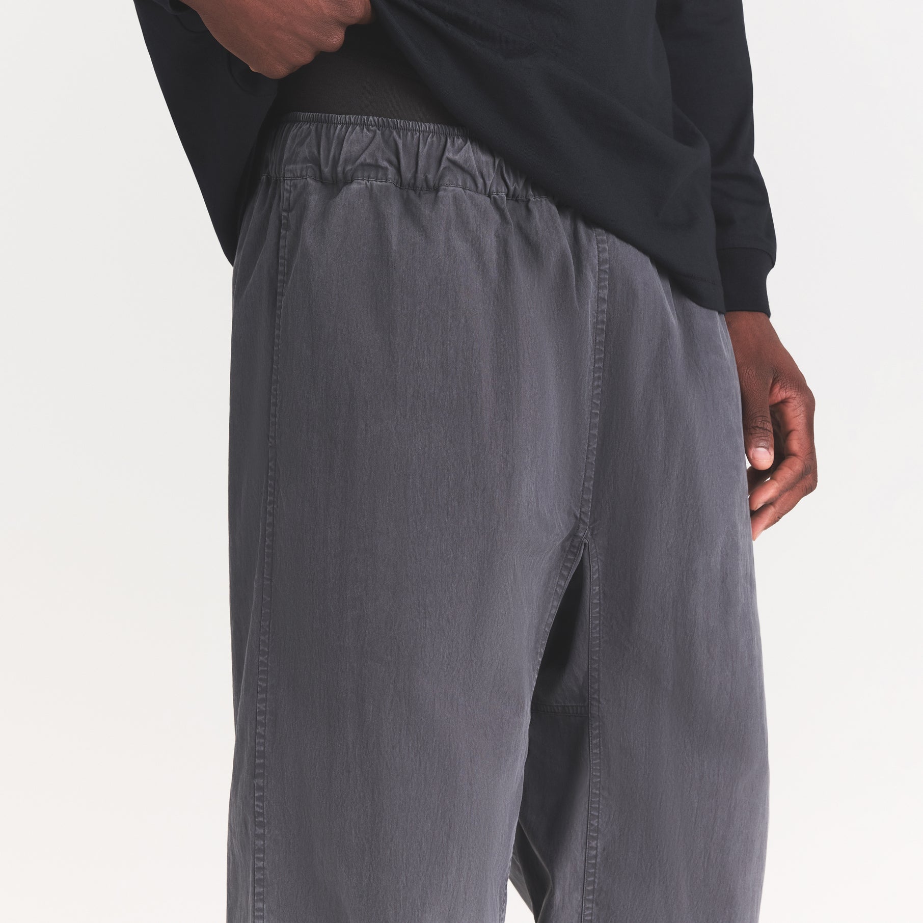 WOVEN MENS KARATE PANT | ASH ON A MODEL SIDE VIEW @ | FOCUS: 0.0, 1.0, 0.9