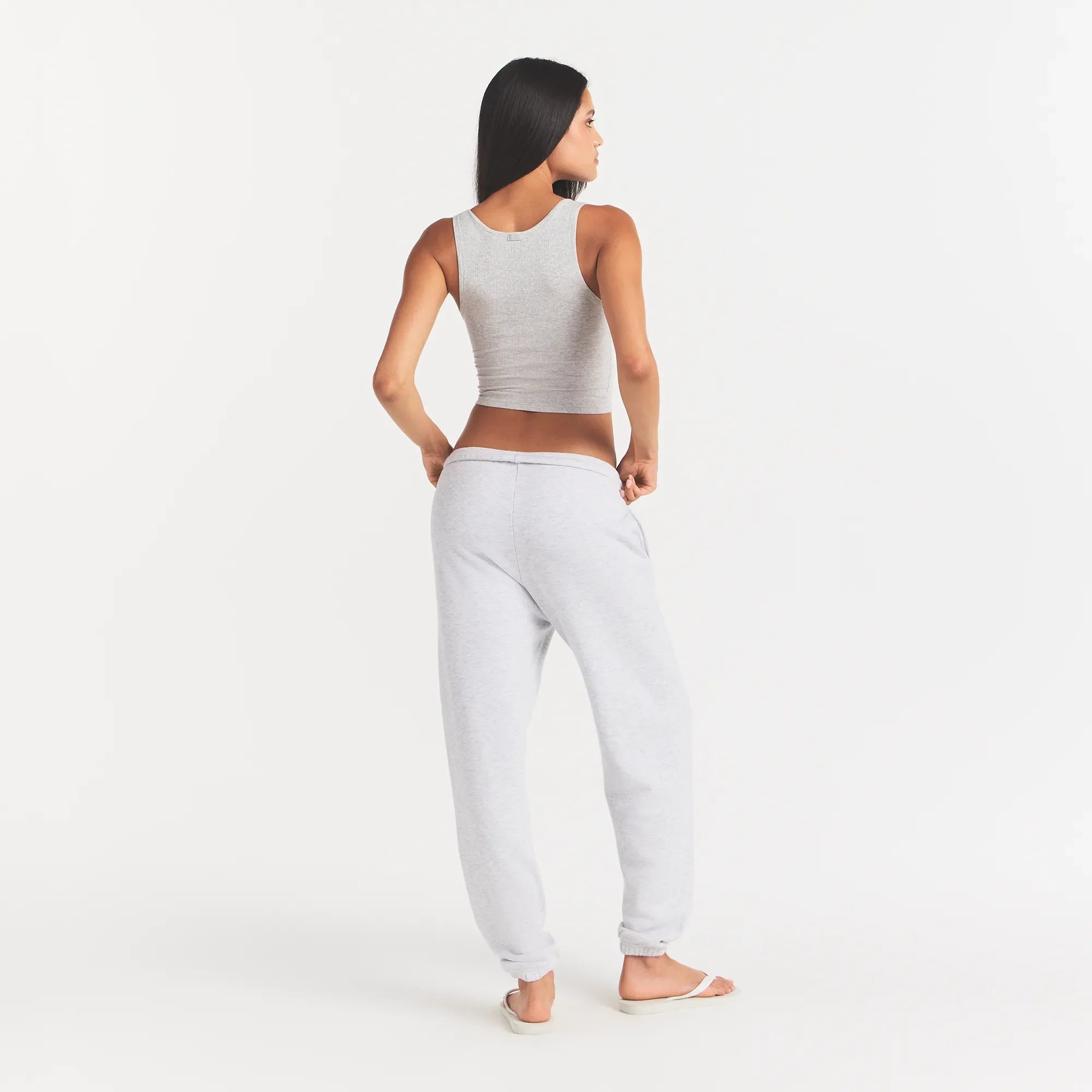 COTTON FLEECE JOGGER | LIGHT HEATHER GREY WITH ONYX LOGO ON A MODEL BACK VIEW @ | FOCUS: 0.0, 1.0, 0.9