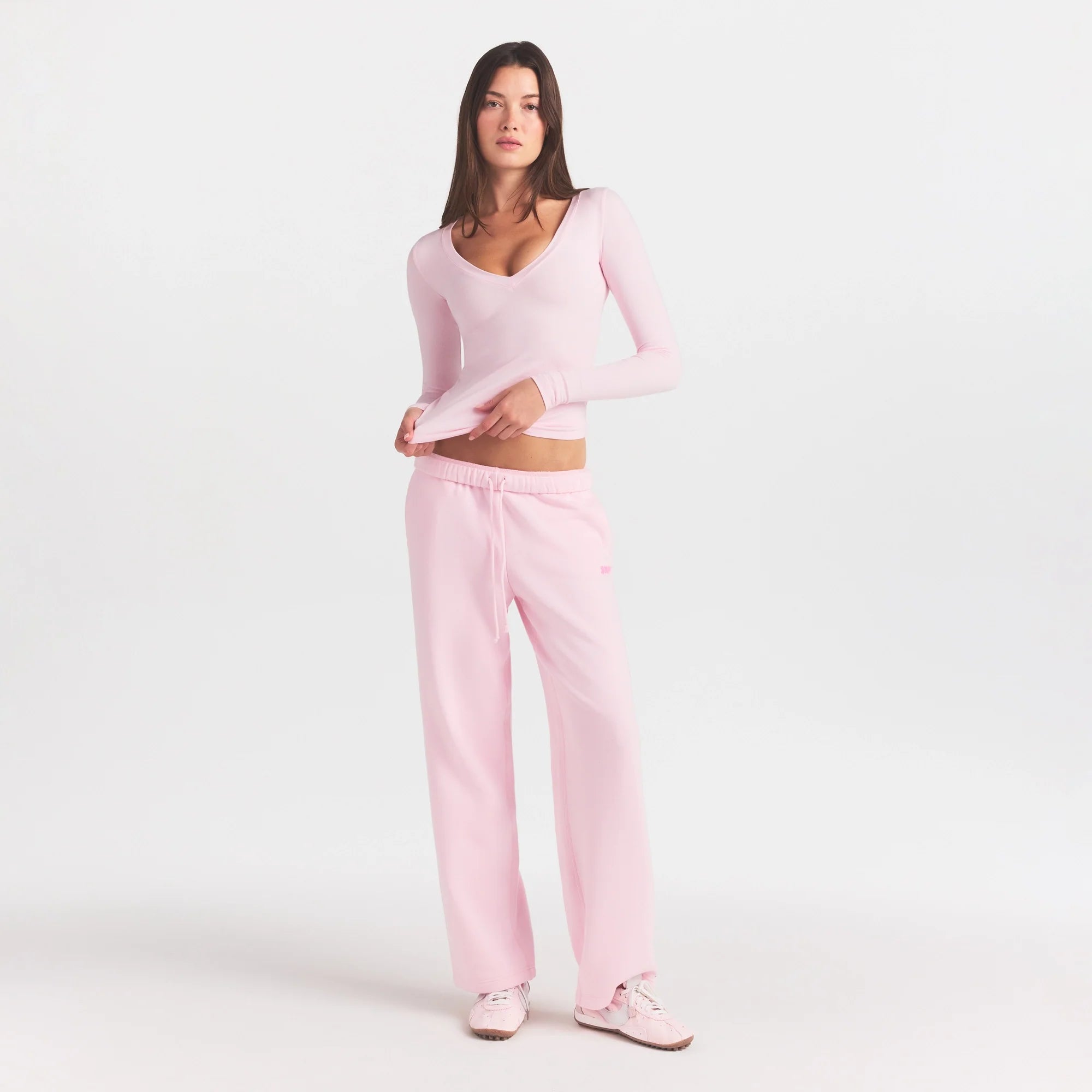 COTTON FLEECE STRAIGHT LEG PANT WITH EMBOSSED LOGO | CHERRY BLOSSOM ON A MODEL FRONT VIEW @ | FOCUS: 0.0, 1.0, 0.9